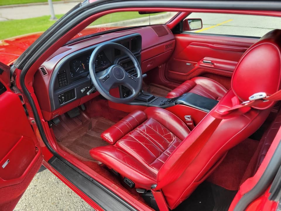 Red leather interior of 1988 Mercury Cougar XR-7