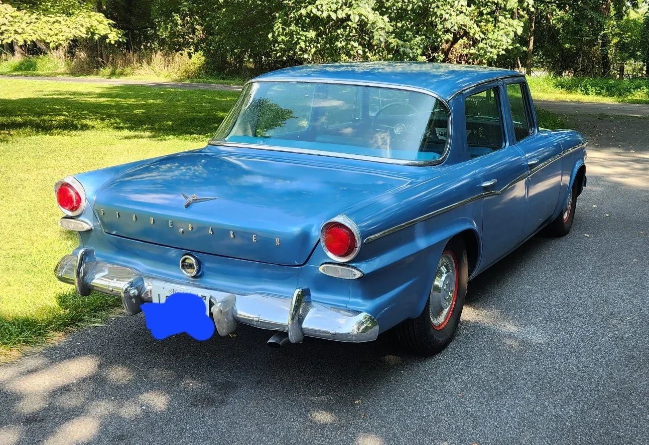 Passenger rear three-quarter view of blue 1962 Studebaker Lark Sedan