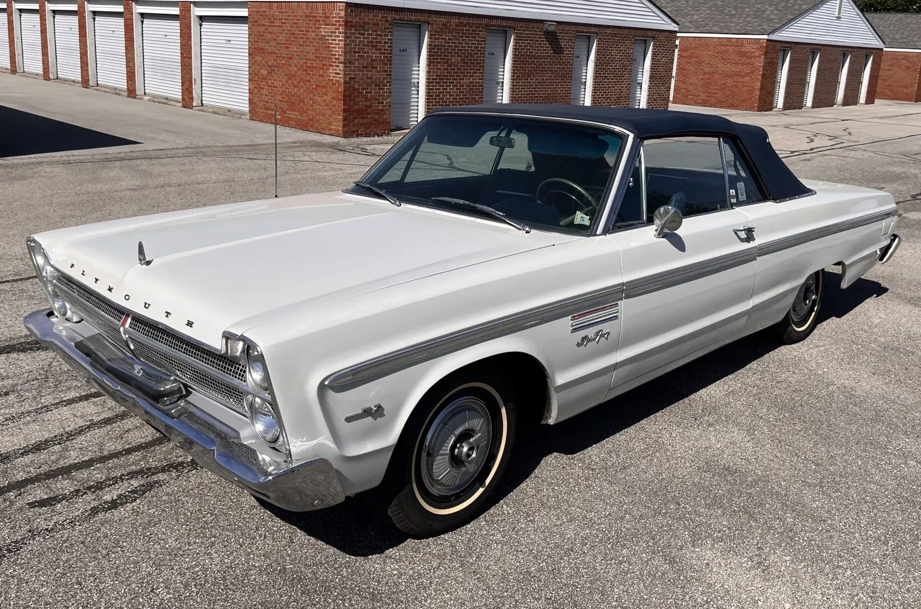 Driver front three-quarter view of white 1965 Plymouth Sport Fury
