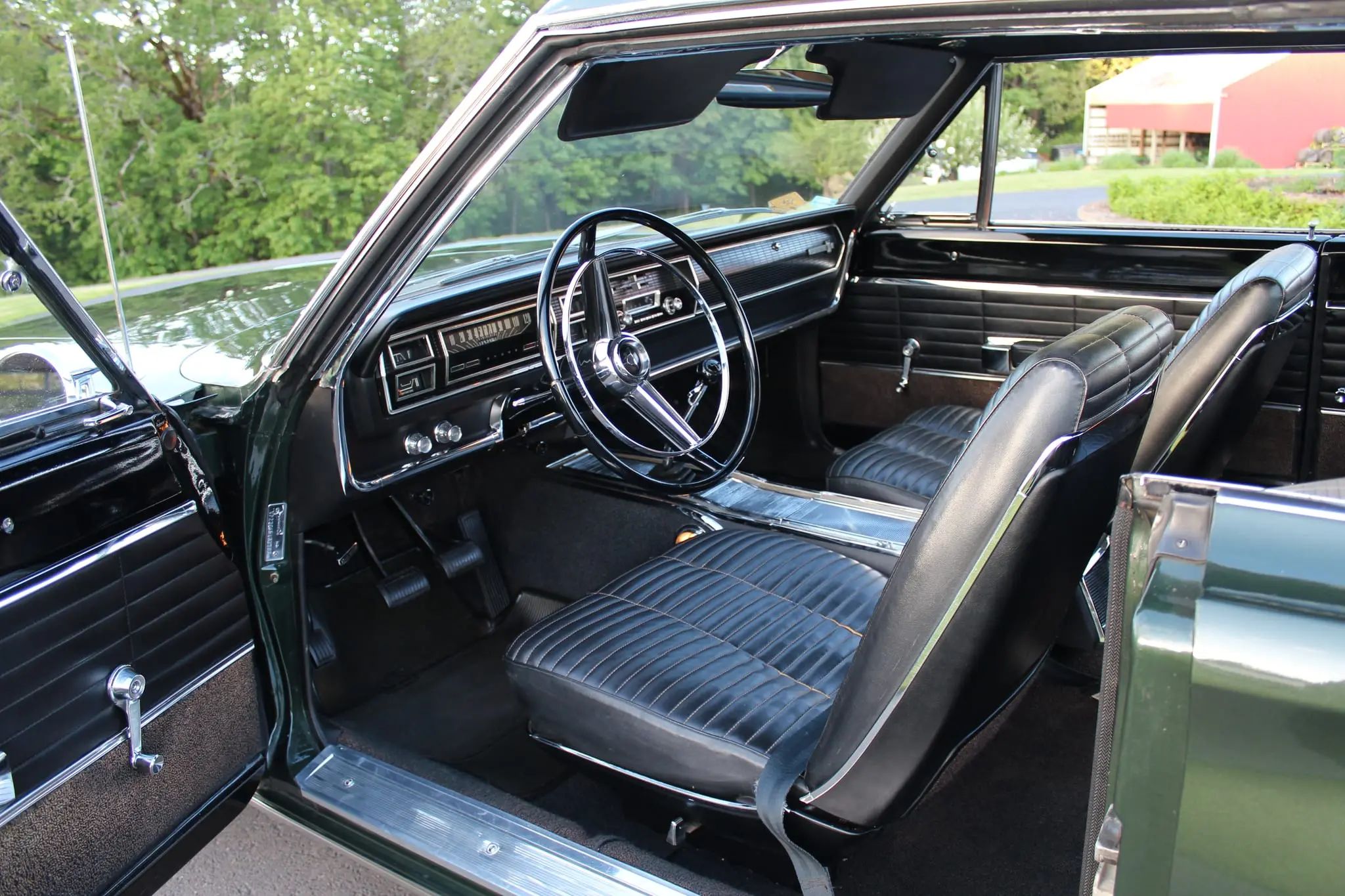 Black interior of 1966 Dodge Coronet with four-speed manual transmission