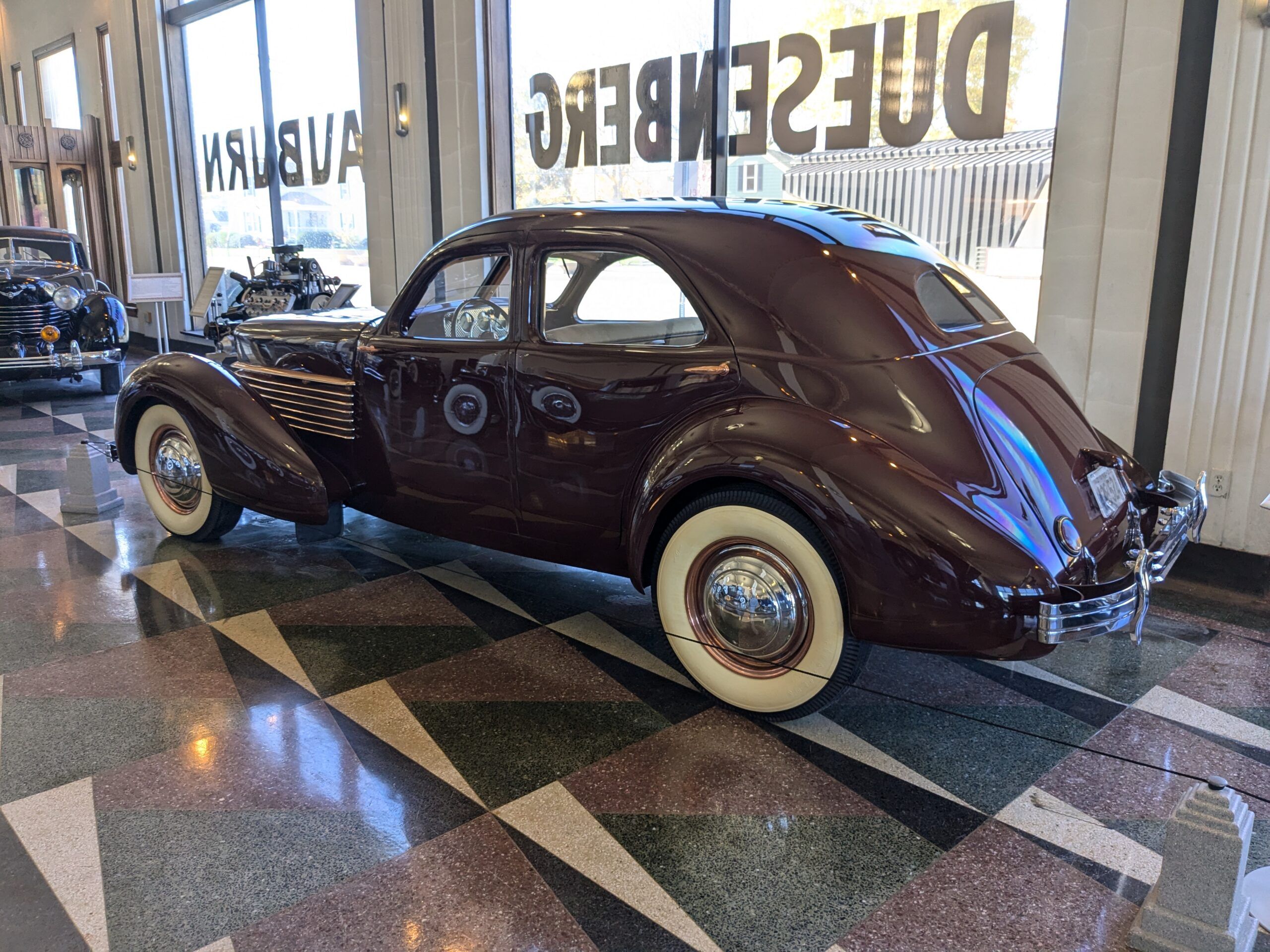 Driver rear three-quarter view of 1936 Cord 810 Westchester