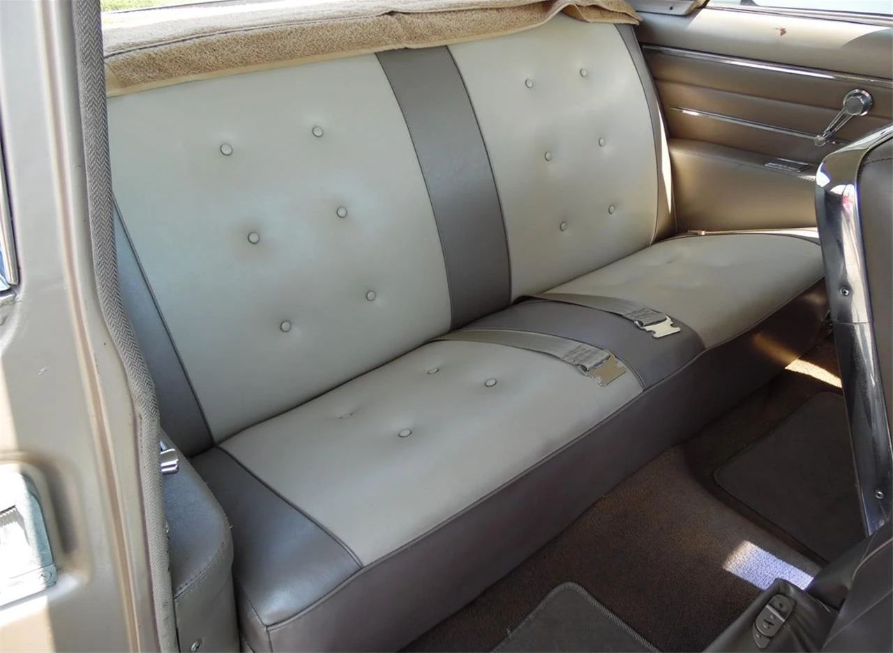 Back seat of a 1961 Buick Skylark, seen through the right front door