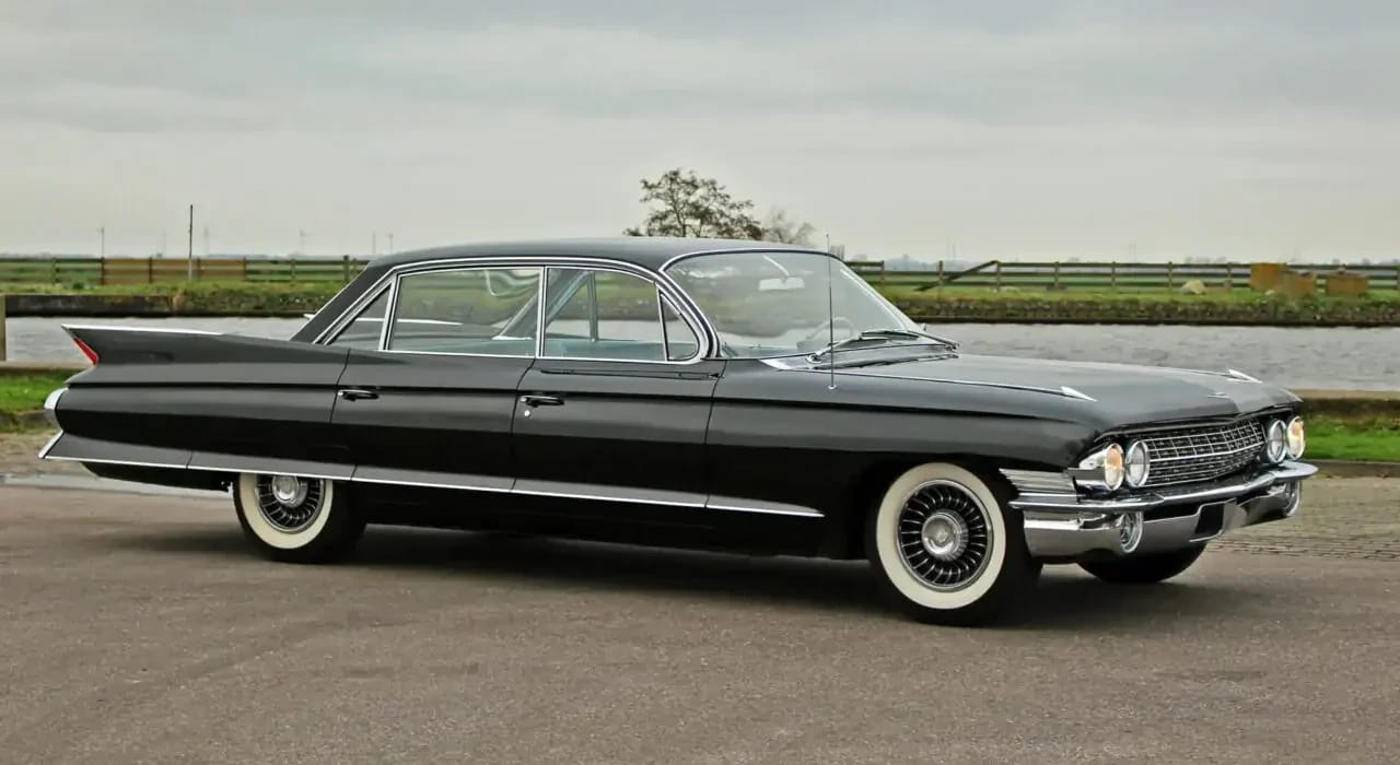From Flattop To Formal: Cadillac's 1959–1964 Four-Window And Six-Window Four-Door Hardtops 26 Right front 3q view of a 1961 Cadillac six-window four-door hardtop with its headlights on