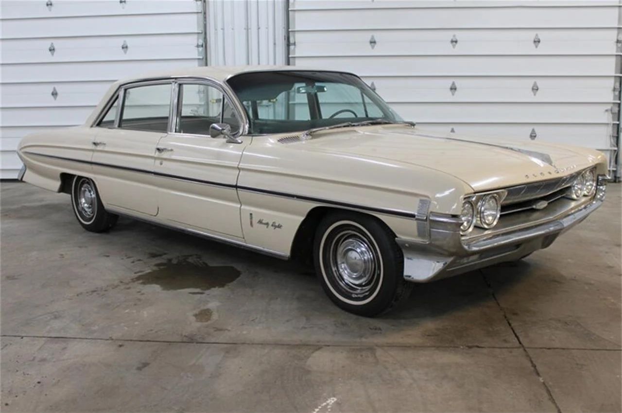 1966 Oldsmobile Ninety-Eight Town Sedan: GM's Cheapest C-Body Luxury Car 3 Right front 3q view of a 1961 Oldsmobile sedan in an indoor garage