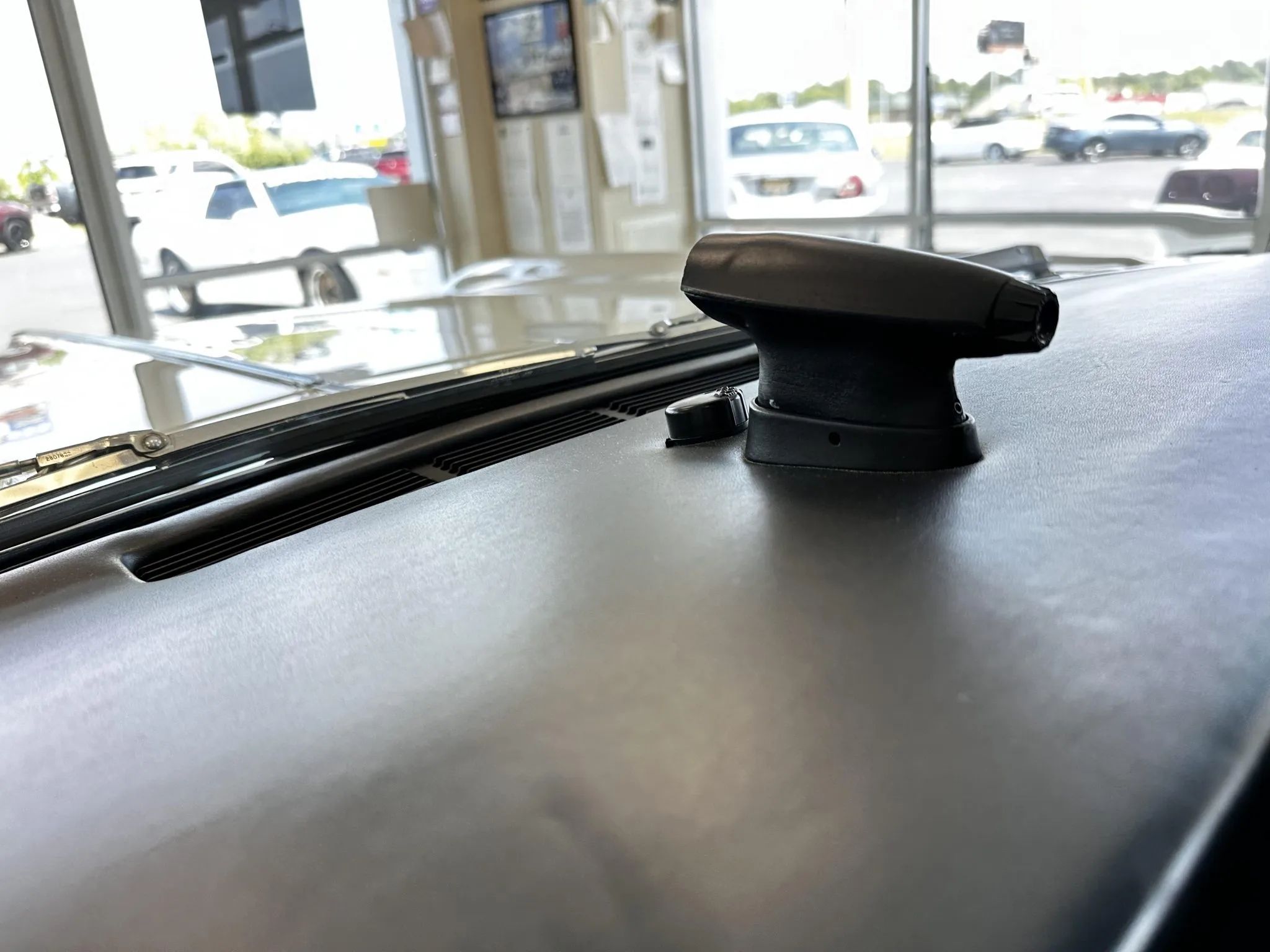 Automatic headlight dimmer pod atop the dashboard of a 1963 Riviera