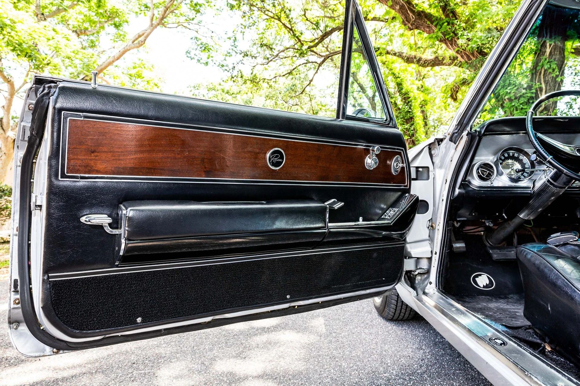 Driver's door trim of a 1963 Riviera with wood veneer