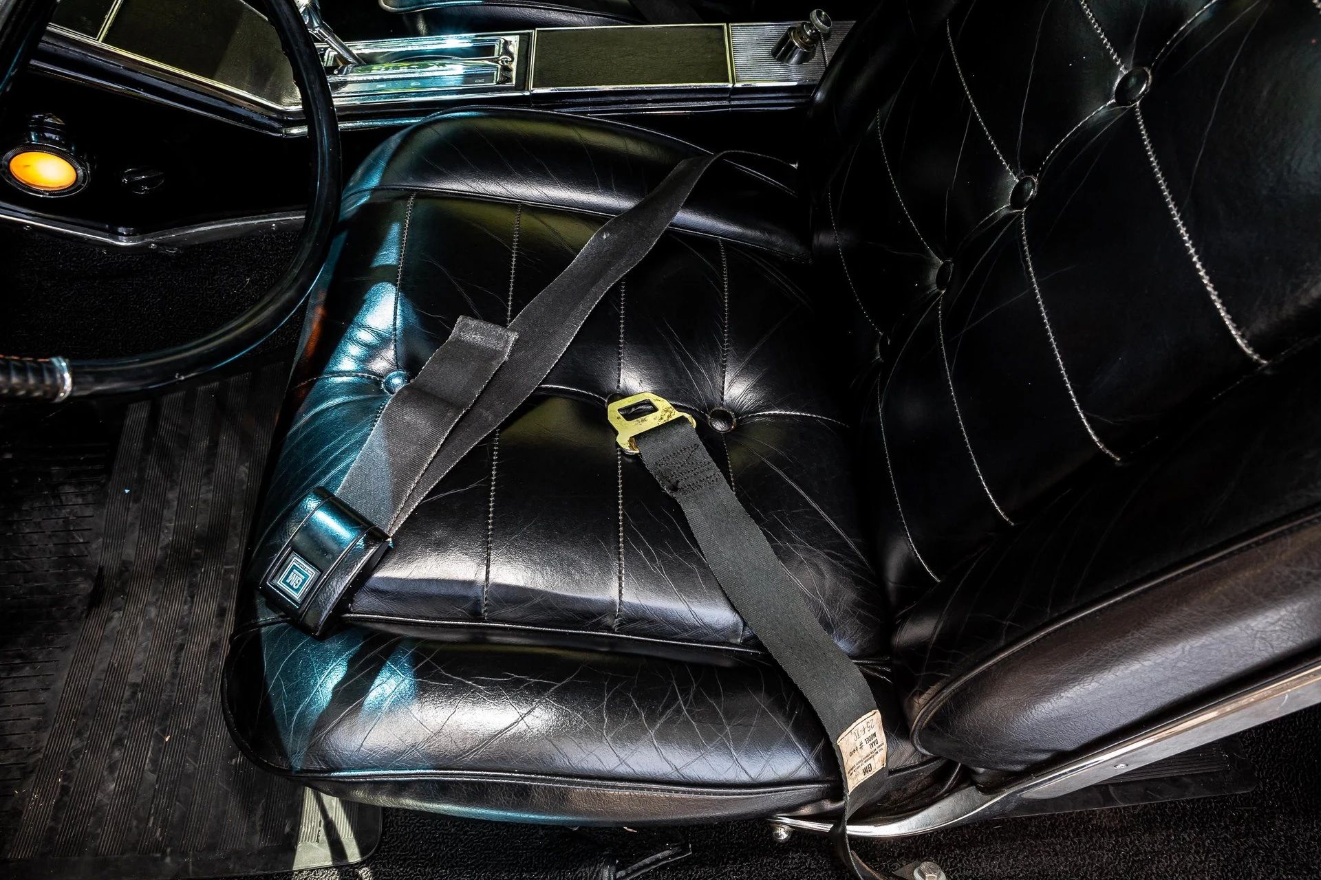 Front seat cushion of a 1963 Riviera with lap belts