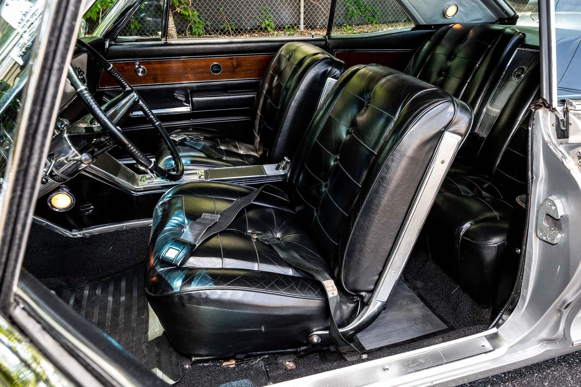 Front seats of a 1963 Riviera, seen through the driver's door