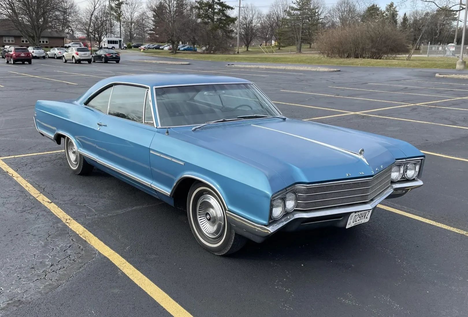 Right front 3q view of a 1966 Buick two-door hardtop in a parking lot