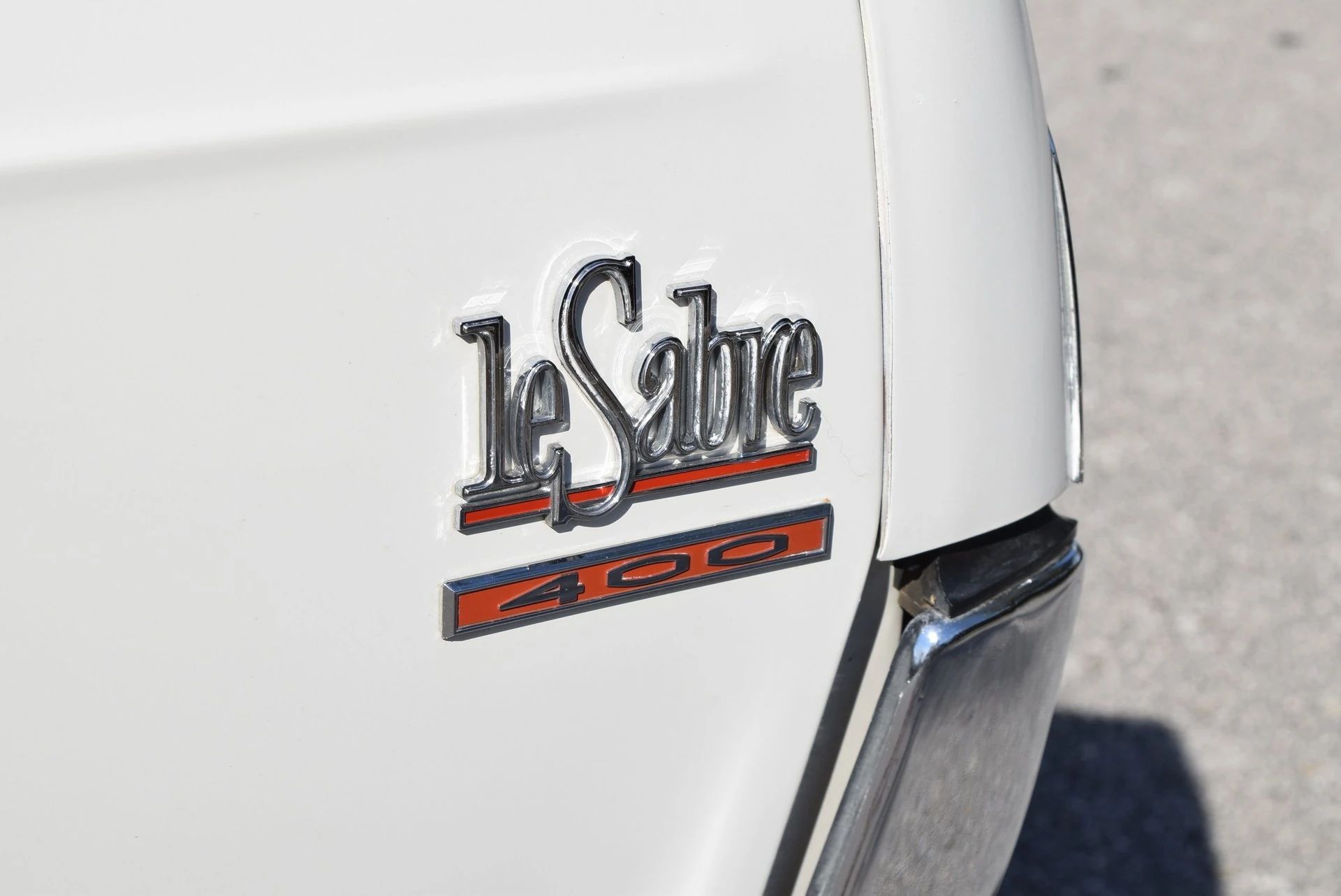 LeSabre 400 badges on the front fender of a white car