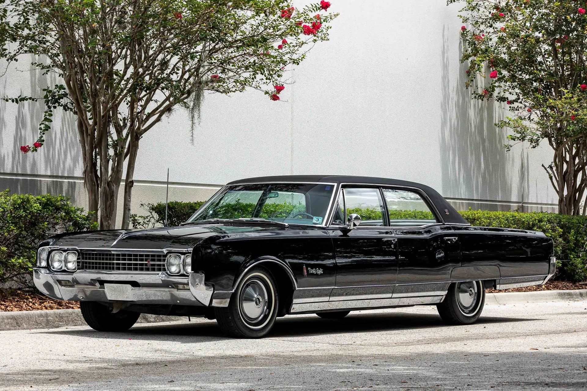 1966 Oldsmobile Ninety-Eight Town Sedan: GM's Cheapest C-Body Luxury Car 1 Left front 3q view of an Ebony Black 1966 Oldsmobile Ninety-Eight Town Sedan with a black vinyl top