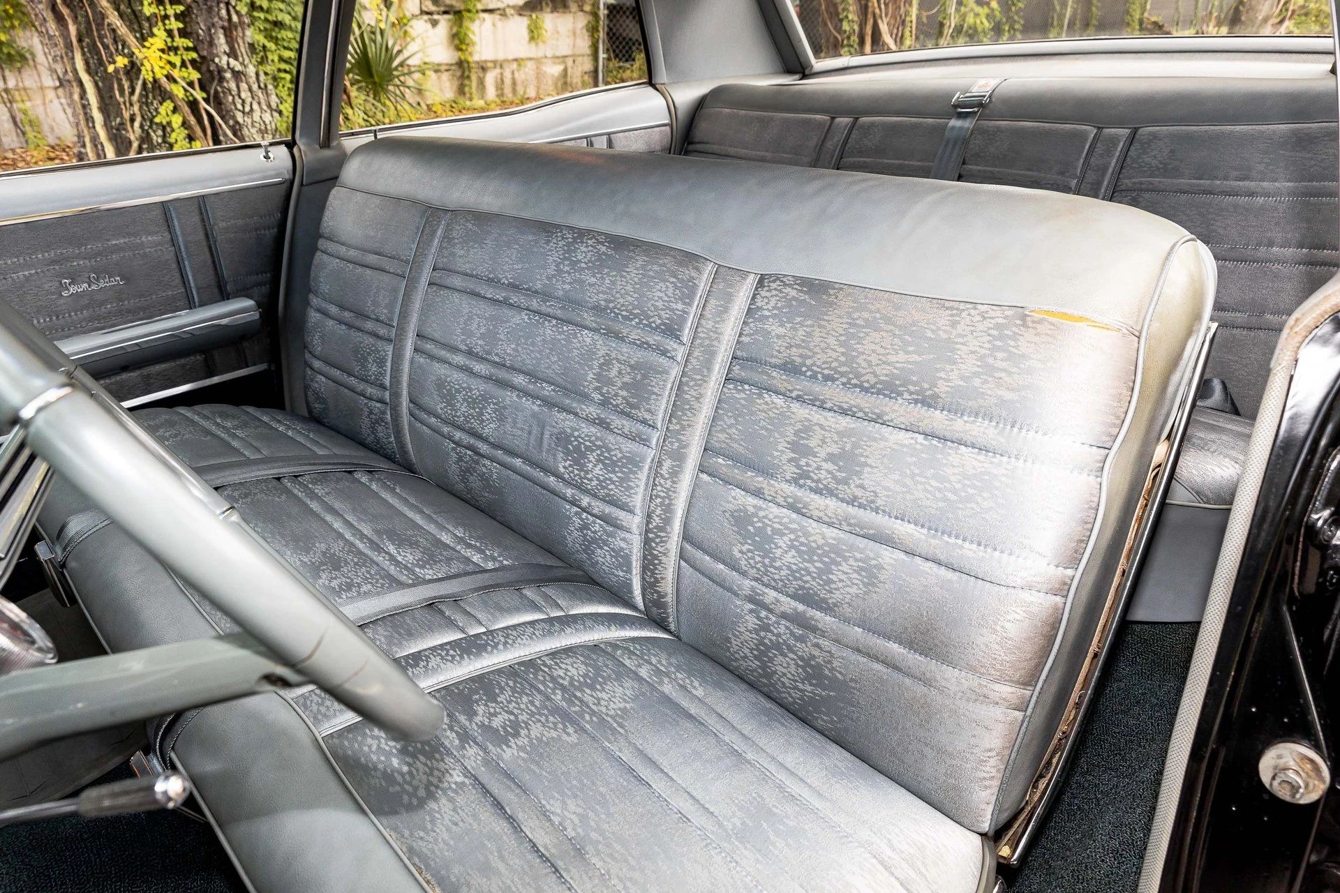 1966 Oldsmobile Ninety-Eight Town Sedan: GM's Cheapest C-Body Luxury Car 10 Front bench seat in a 1966 Oldsmobile Ninety-Eight, seen from the left; the left edge of the upholstery is a bit torn