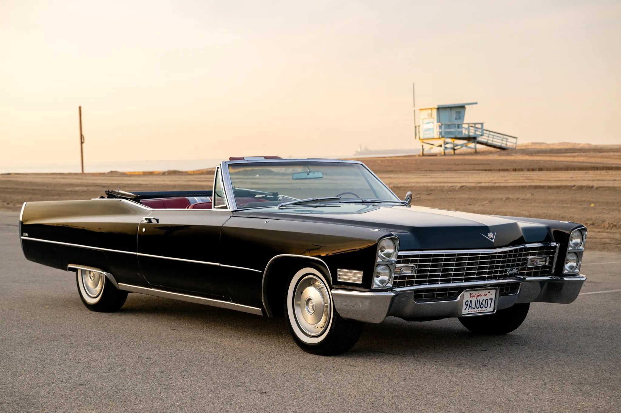 Right front 3q view of a 1967 Cadillac convertible with the top down at sunset