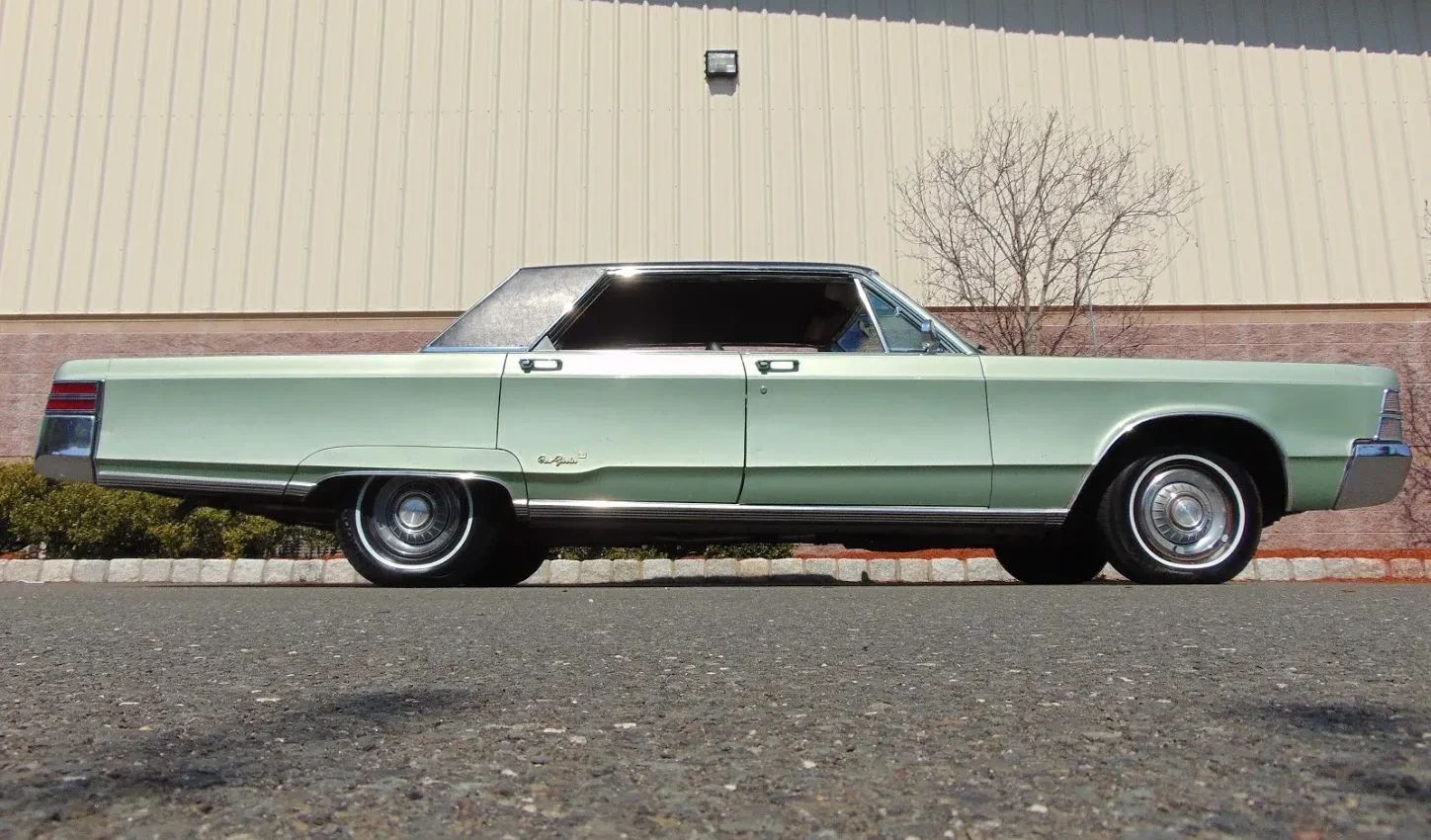 Low-angle right side view of a 1967 Chrysler four-door