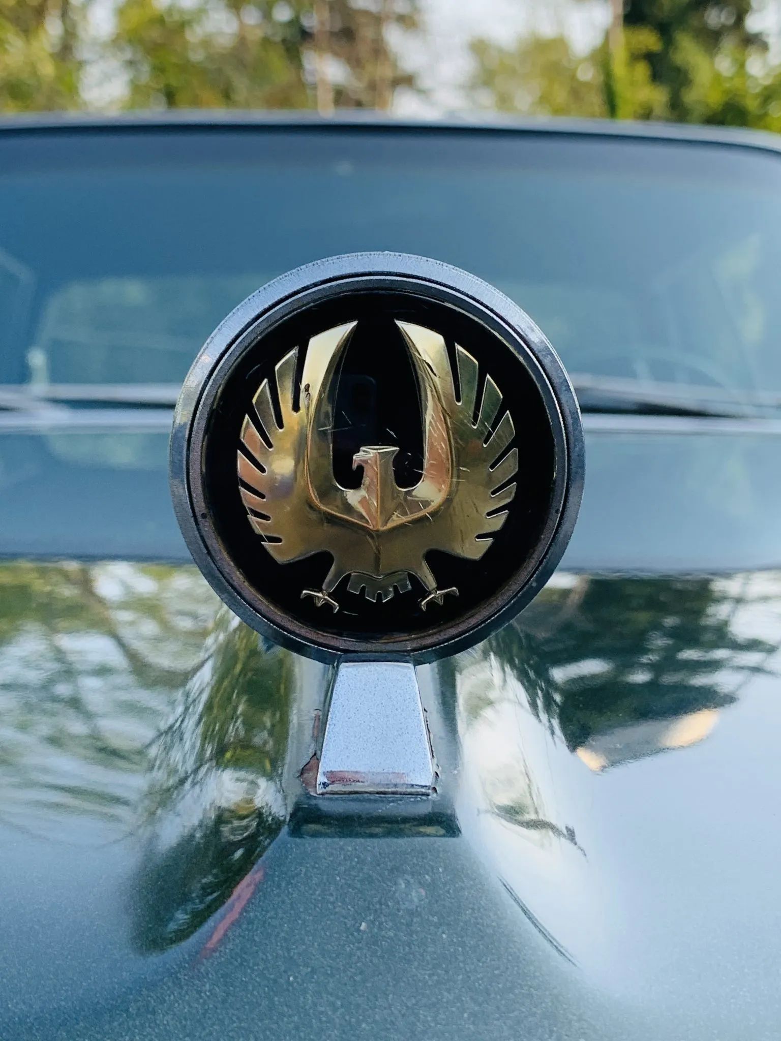 Closeup of the eagle hood ornament on the hood of a 1967 Imperial