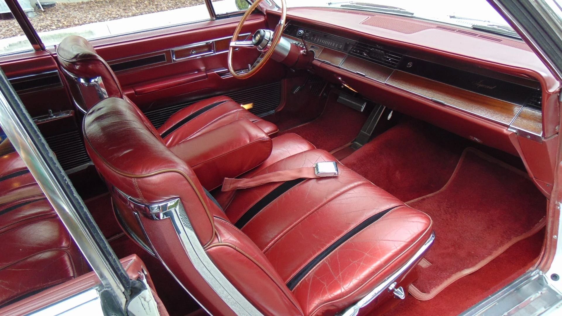 Dashboard and front seats of a 1967 Imperial convertible, seen over the passenger door