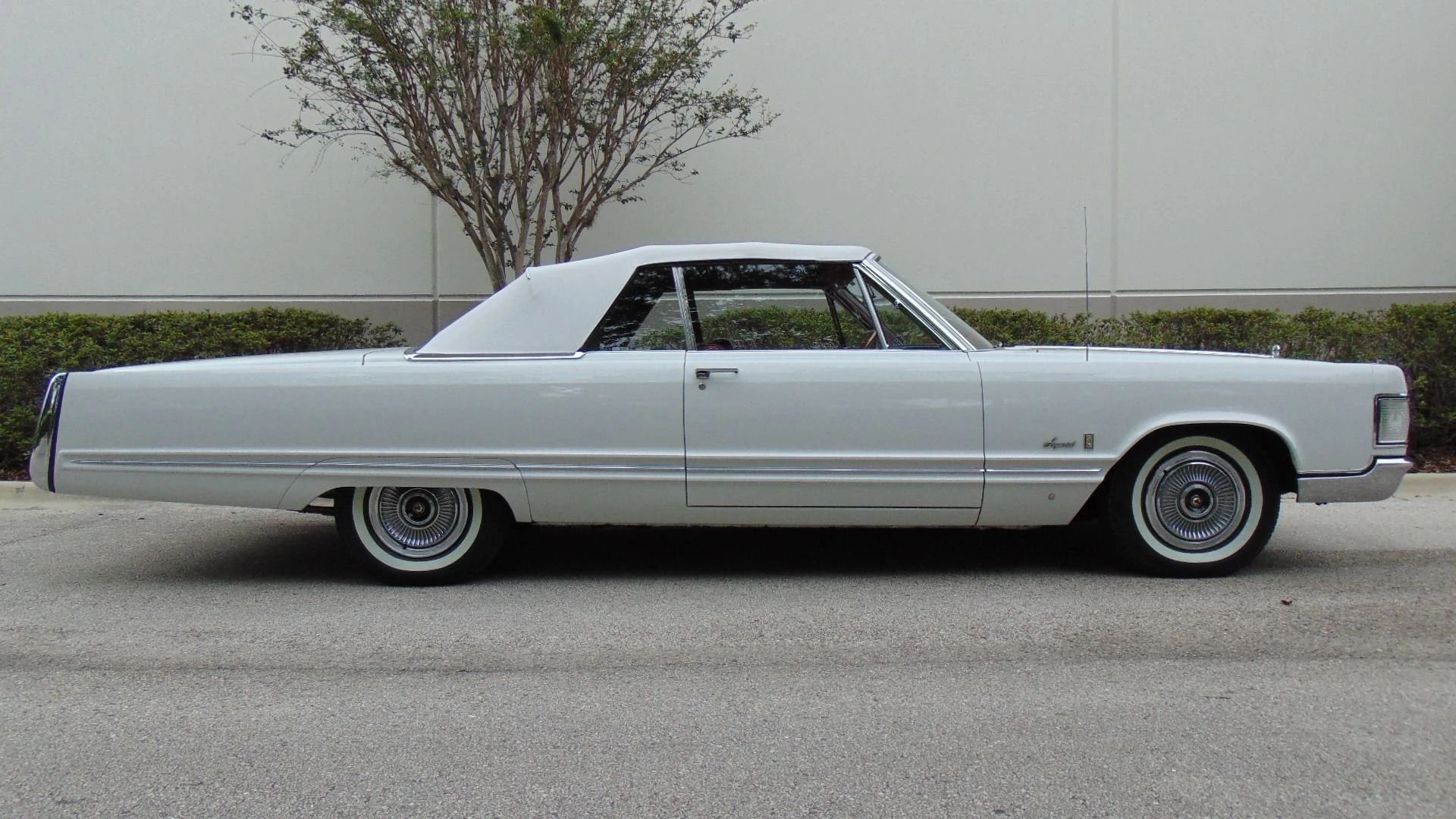 Right side view of a 1967 Imperial convertible with its top up
