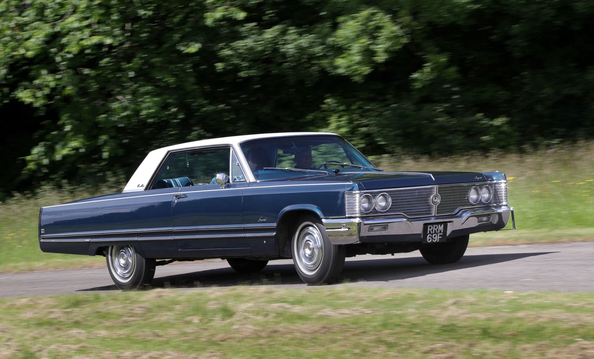 Right front 3q view of a 1968 Imperial two-door hardtop being driven on a narrow lane