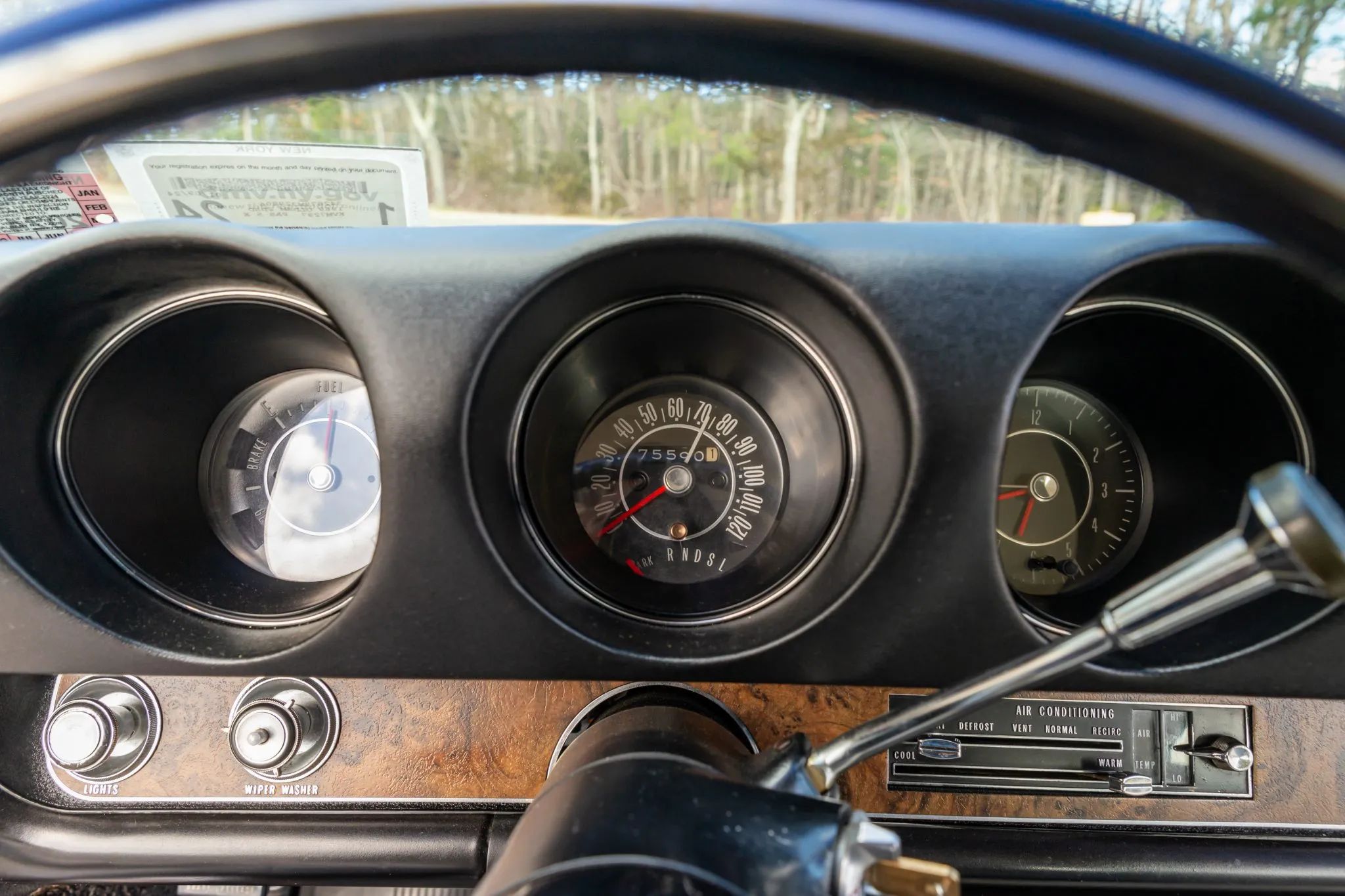Dashboard of a 1969 Oldsmobile A-body, seen through the steering wheel rim