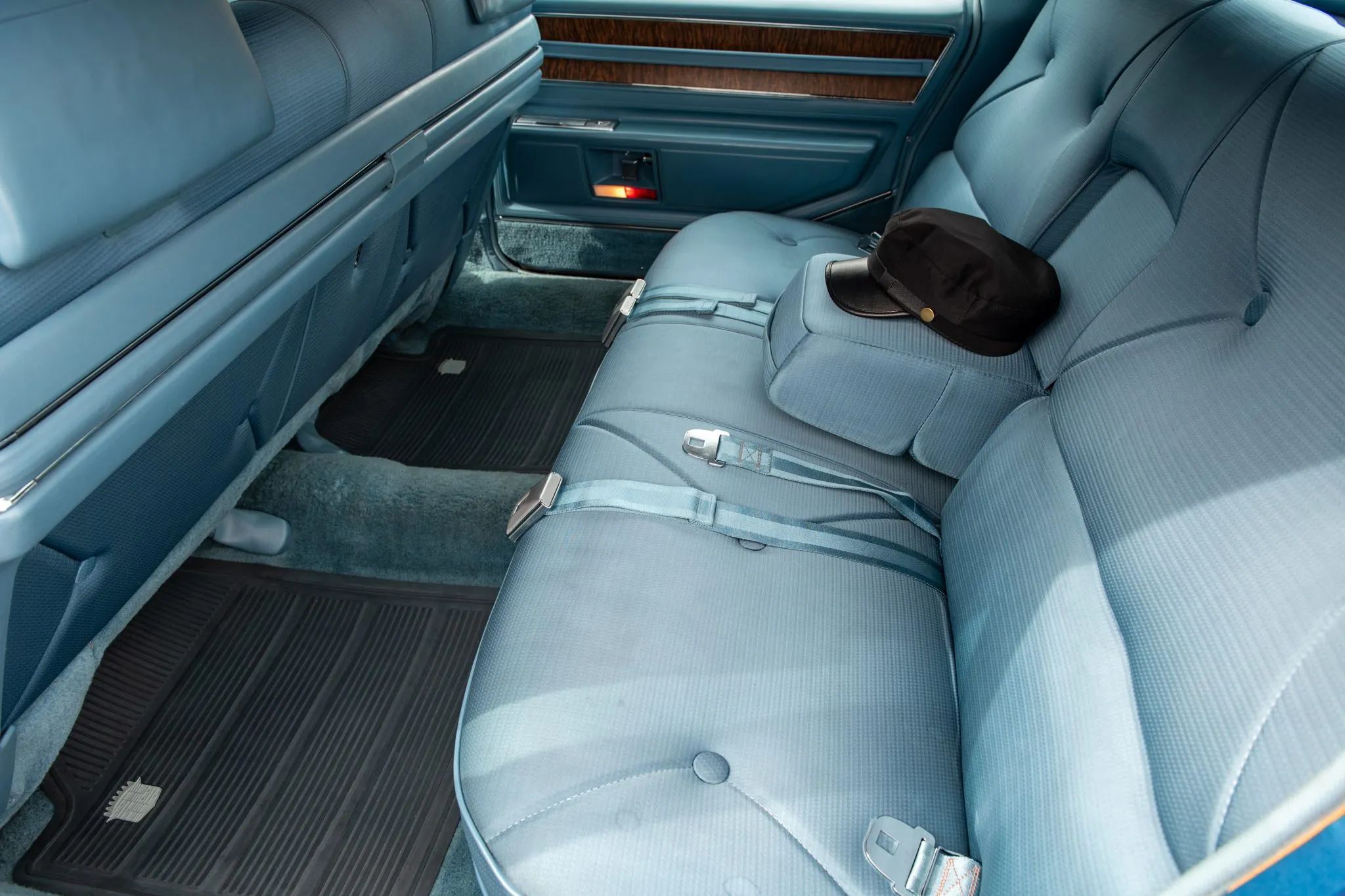 1970 Cadillac Fleetwood Sixty Special: A Chauffeur-Driven Example Of The Rare Final RWD Sixty Special 5 Back seat of a 1970 Cadillac Sixty Special, with a chauffeur's cap perched on the center armrest