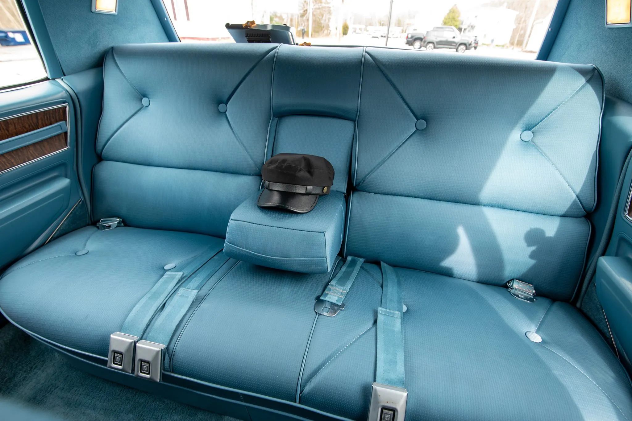 1970 Cadillac Fleetwood Sixty Special: A Chauffeur-Driven Example Of The Rare Final RWD Sixty Special 11 Back seat of a 1970 Cadillac Fleetwood sedan with a black chauffeur's cap perched on the center armrest