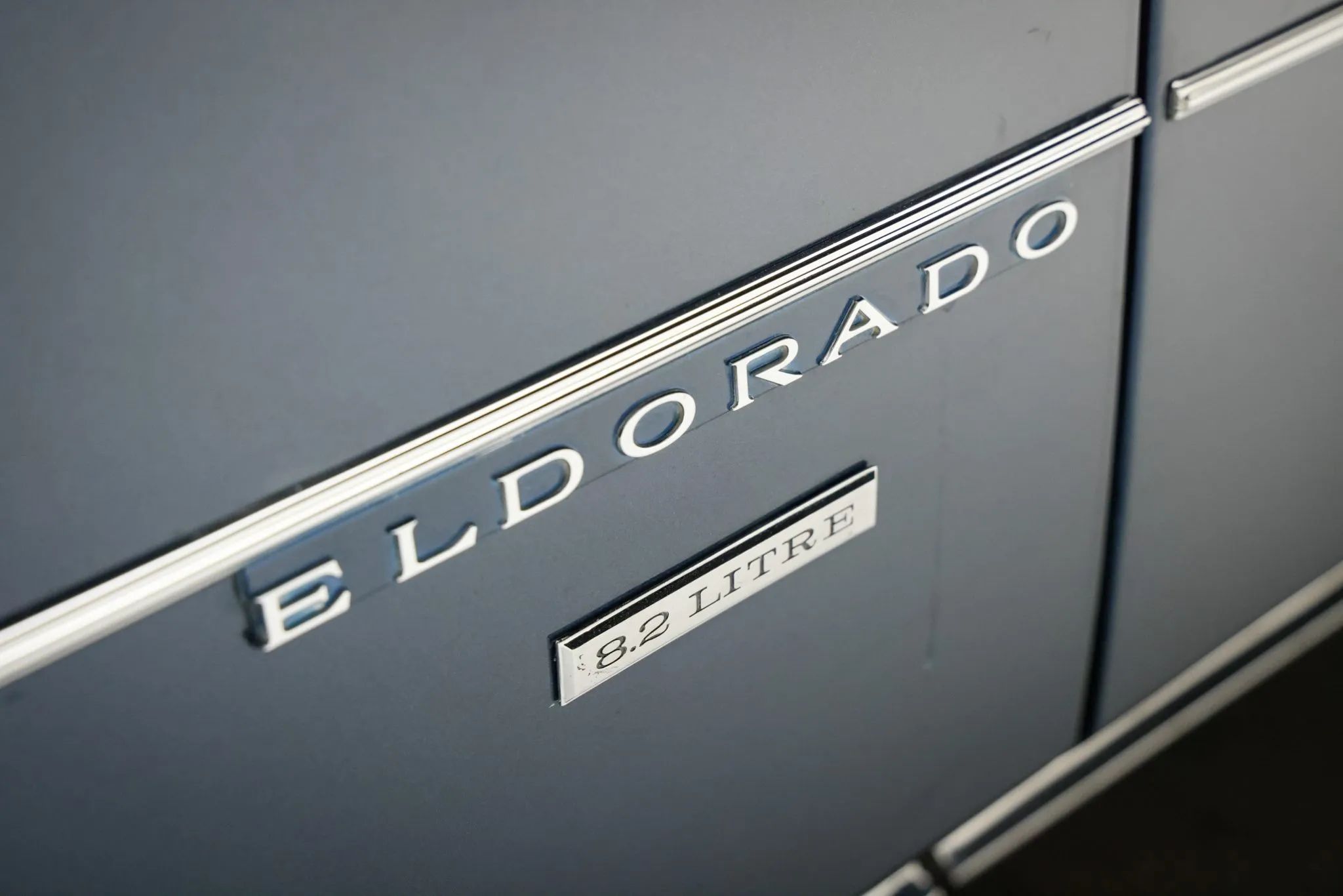 1970 Cadillac De Ville Convertible: The Very Last Full-Size Cadillac Convertible Ever Built 17 "ELDORADO 8.2 LITRE" lettering on the fender of a 1971 Cadillac