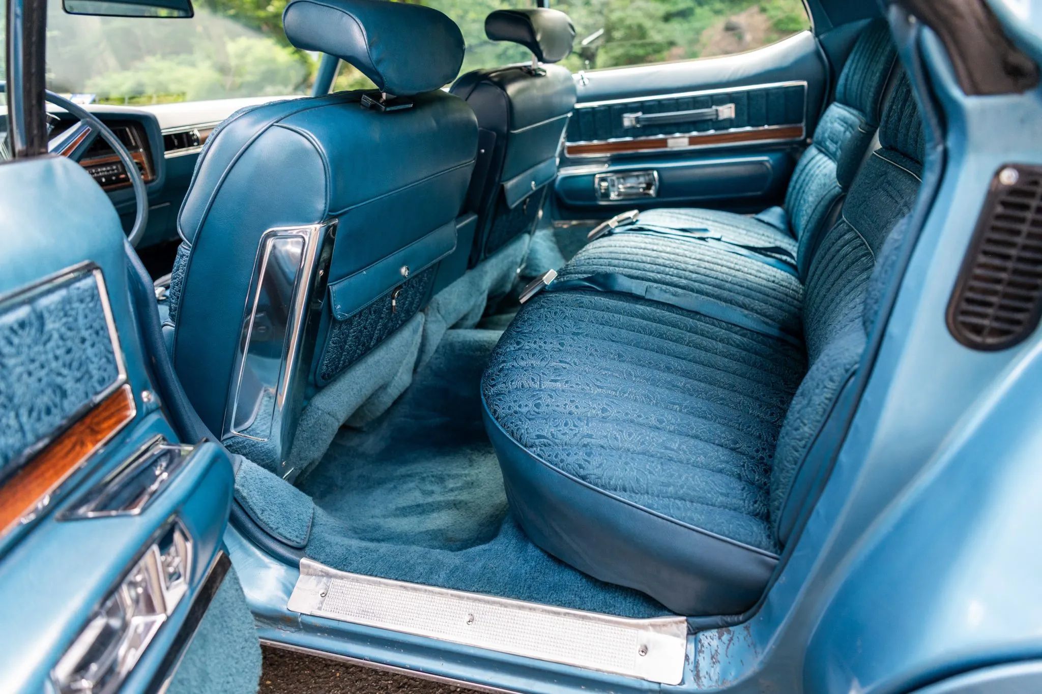 1972 Buick Electra 225 Custom Limited: "The Look Of A Quality Automobile Without Being A Bit Ostentatious" 21 Back seat of a 1972 Buick four-door hardtop, seen through the left rear door; there are map pockets on the back of the front seats