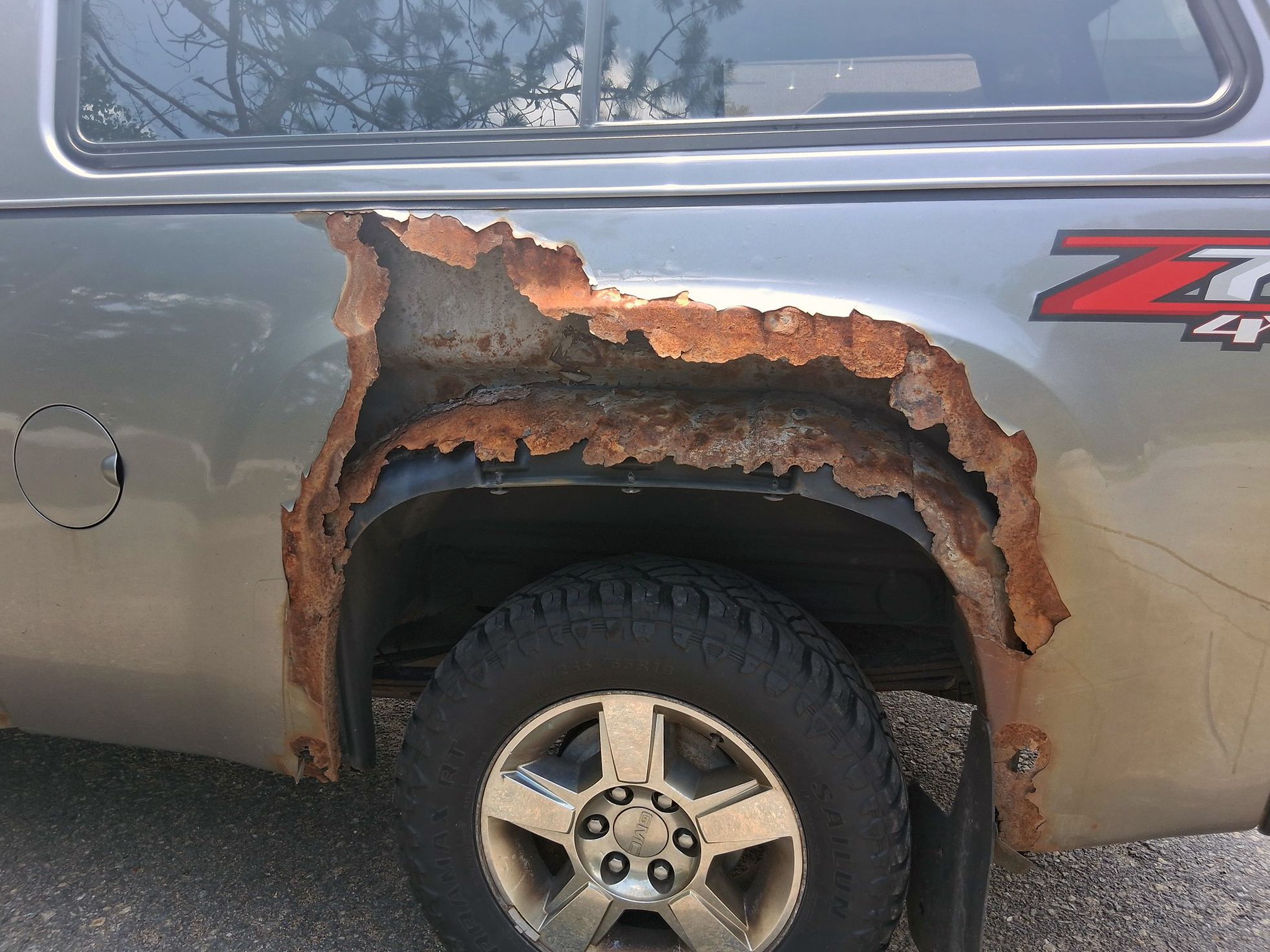 Curbside Find: A GMC Sierra, One Giant Rust Hole, and a Lot of Questions 2 55370742811 3129afa524 k