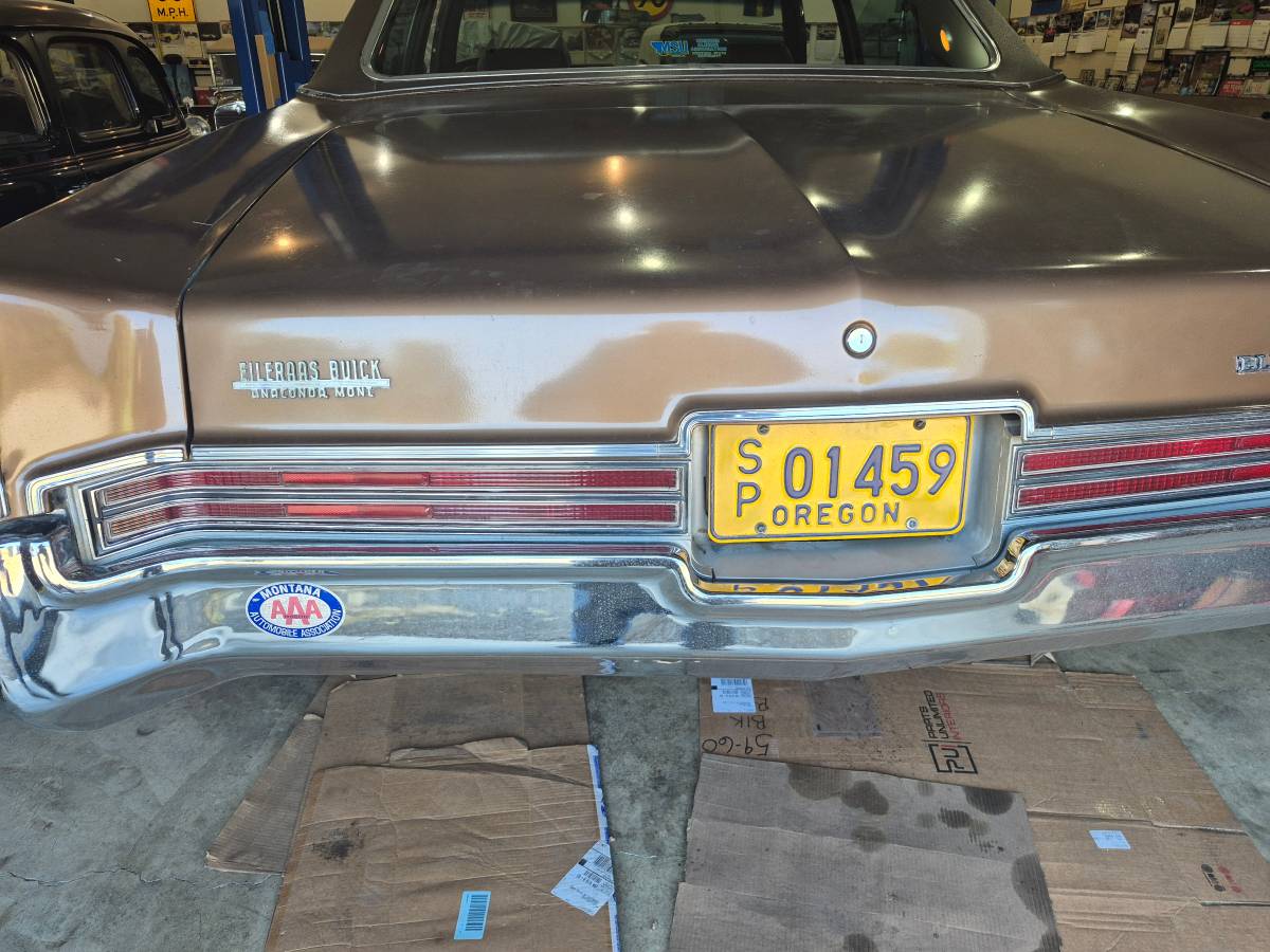 Taillight panel of brown 1970 Buick Electra 225 Sedan