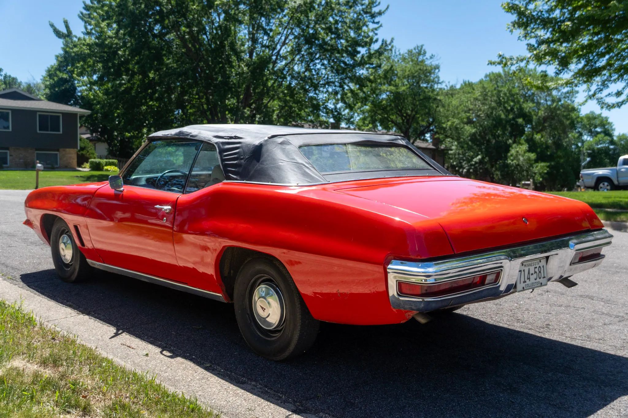 Driver rear 3q view of orange 1972 Pontiac LeMans Sport Convertible