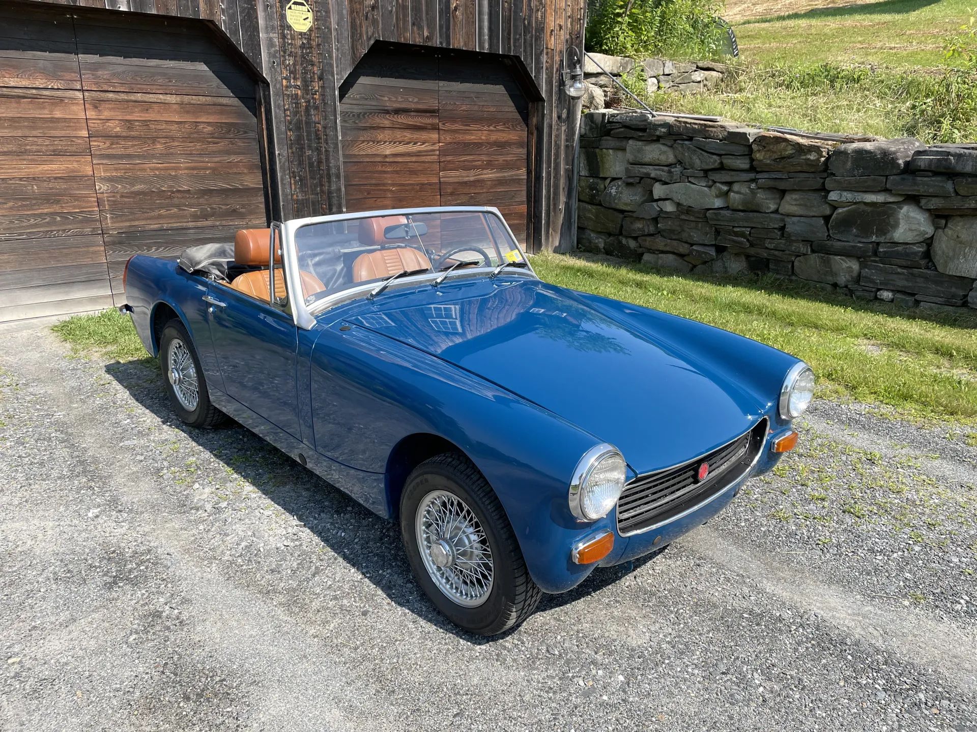 High passenger front 3q view of blue 1973 MG Midget