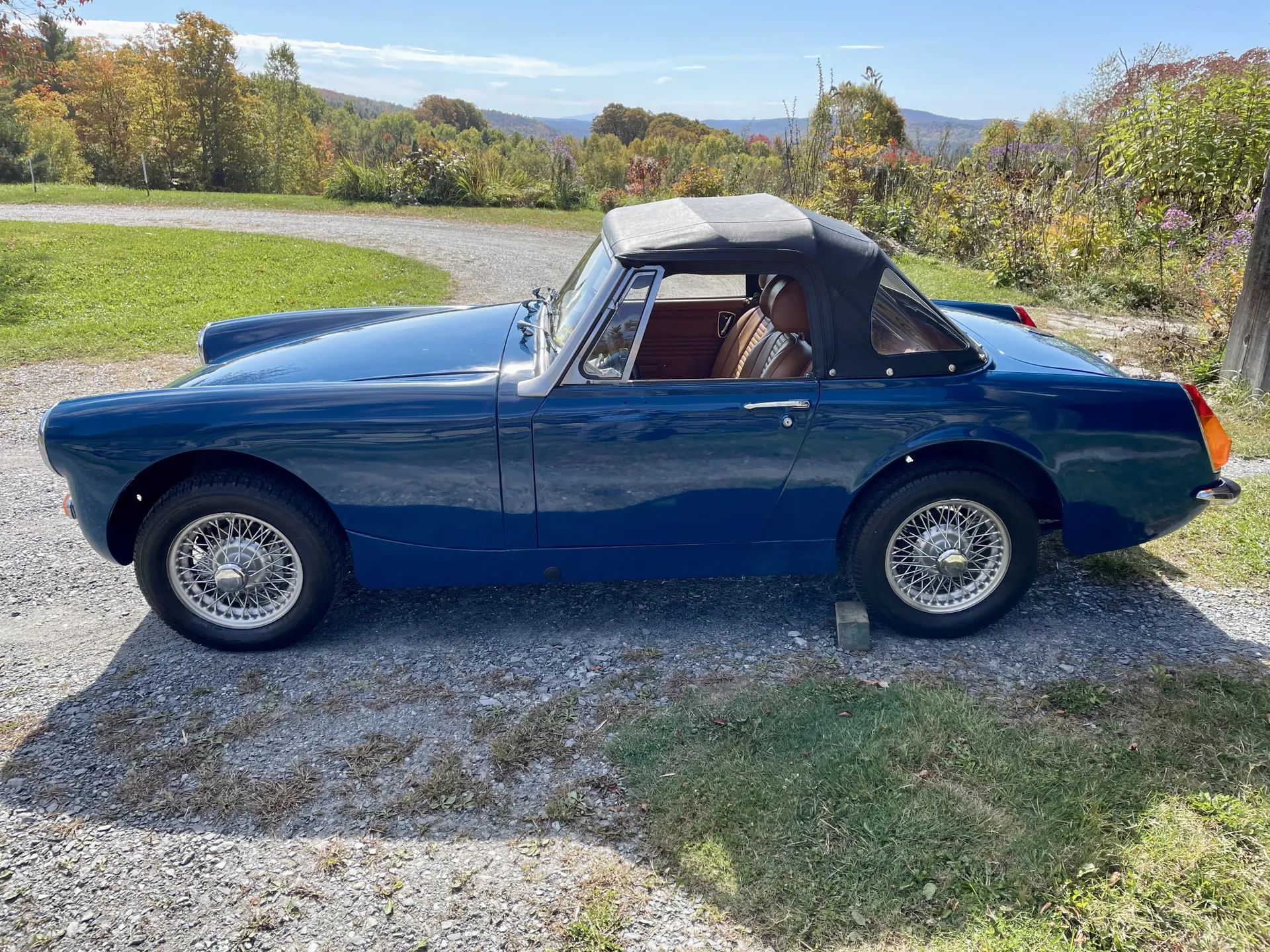 Driver side image of blue 1973 MG Midget