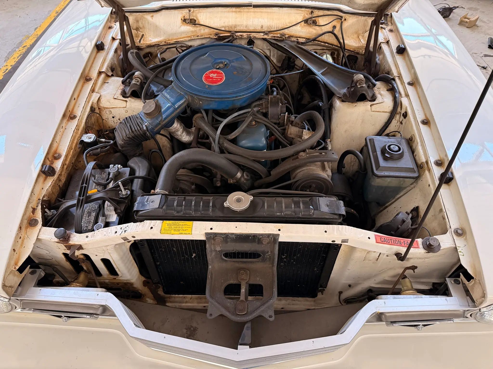 1975 Mercury Comet: A Few-Frills Compact With Surprisingly Little Power 4 Engine compartment of white 1975 Mercury Comet with 250-cubic-inch six-cylinder engine