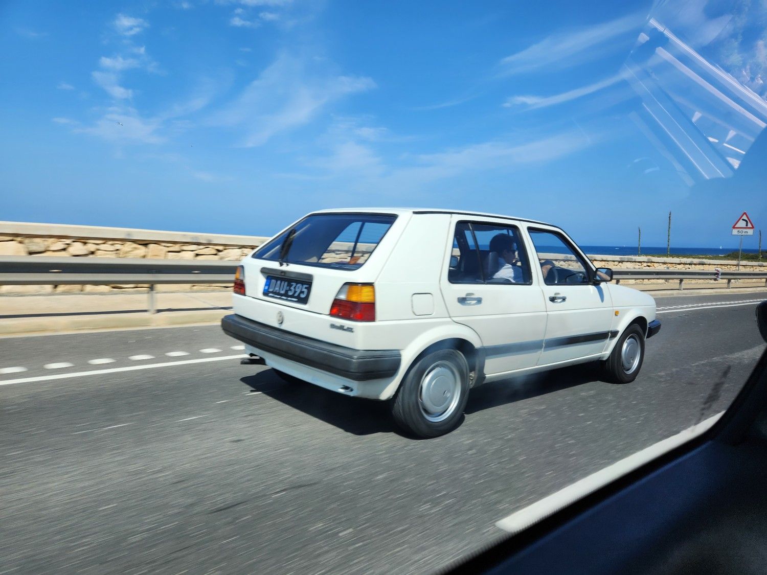 Classic Cars of Malta: Automotive Melting Pot - Ford, Morris, Suzuki, Skoda, etc 25 Volkswagen Golf on road.