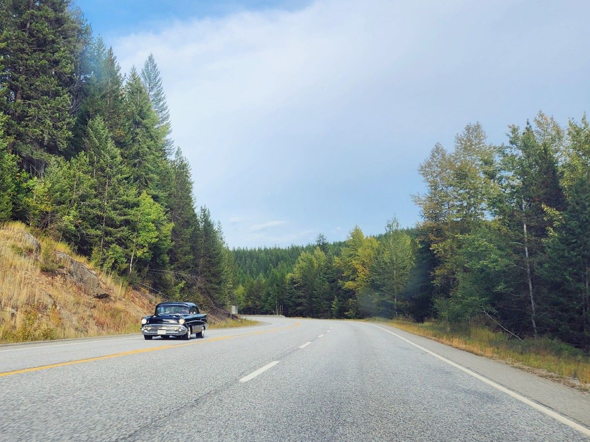 1957 Chevrolet on mountain road.