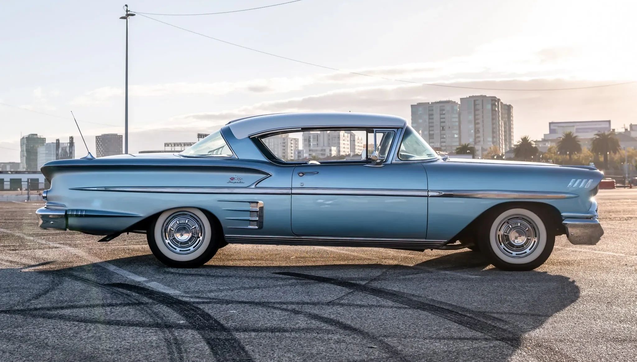 The 1957–1959 Ford-Chevrolet Sales Race: Busting Some Myths About When Ford Finally Beat Chevrolet — Twice 29 Right side view of a 1958 Chevrolet two-door hardtop with a city skyline in the background