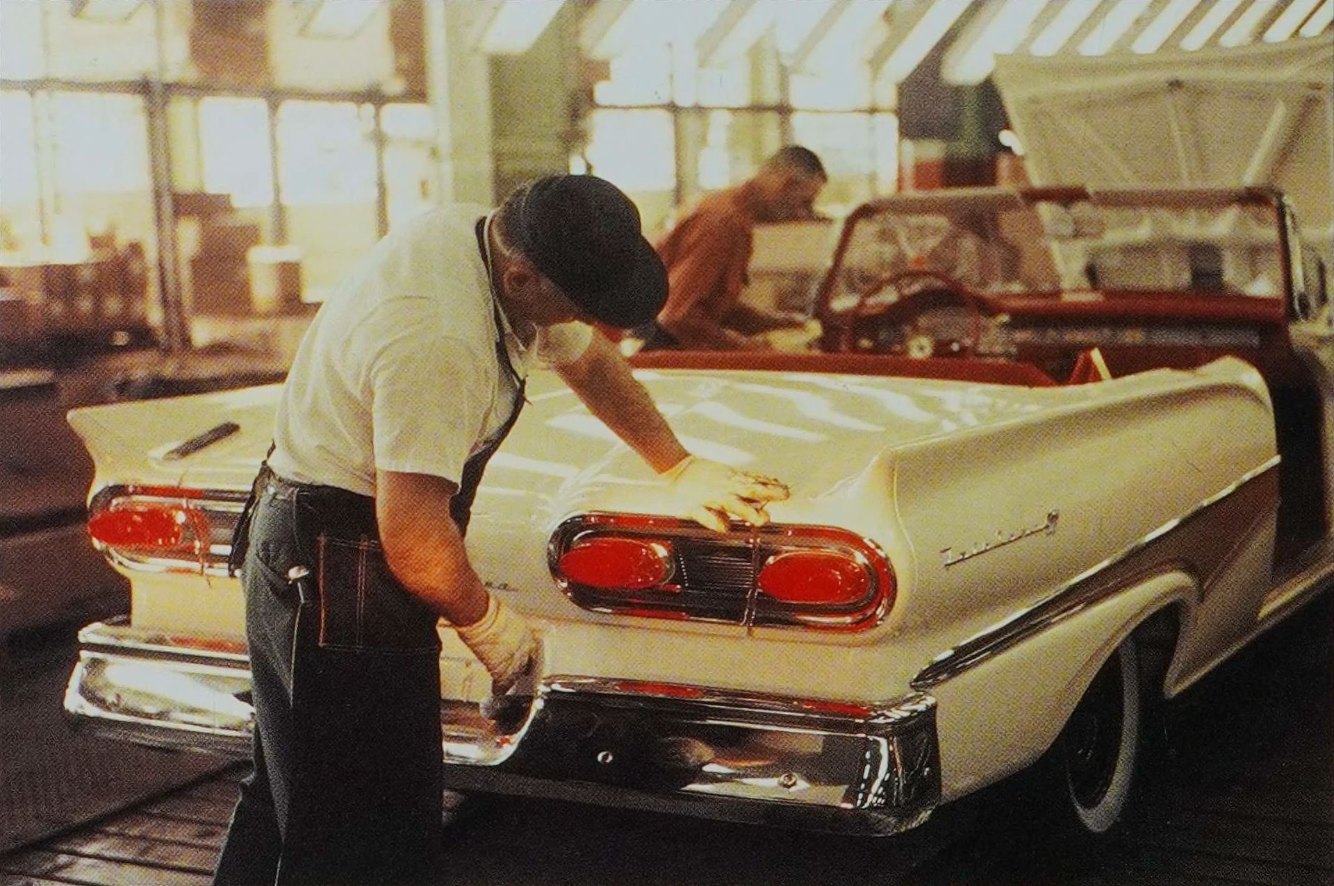 The 1957–1959 Ford-Chevrolet Sales Race: Busting Some Myths About When Ford Finally Beat Chevrolet — Twice 22 Workman inspecting the tail of a yellow 1958 Ford convertible