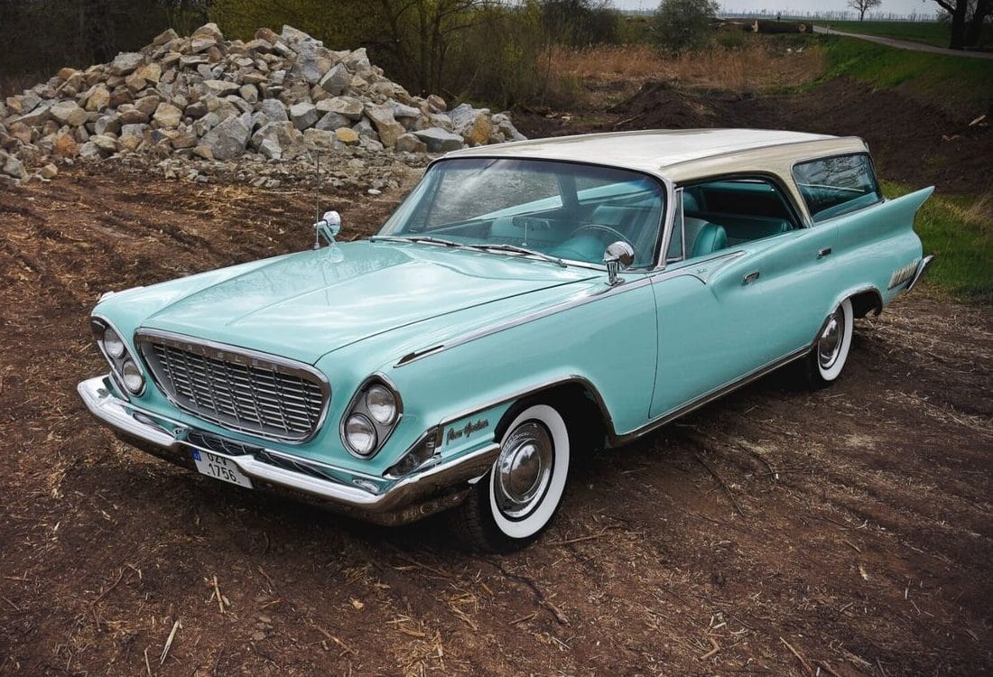 1962 Chrysler New Yorker Town & Country: 1962's Most Expensive Luxury Wagon Was A 1961 Plymouth In Disguise 5 Left front 3q view of a two-tone 1961 Chrysler four-door hardtop wagon with prominent tail fins