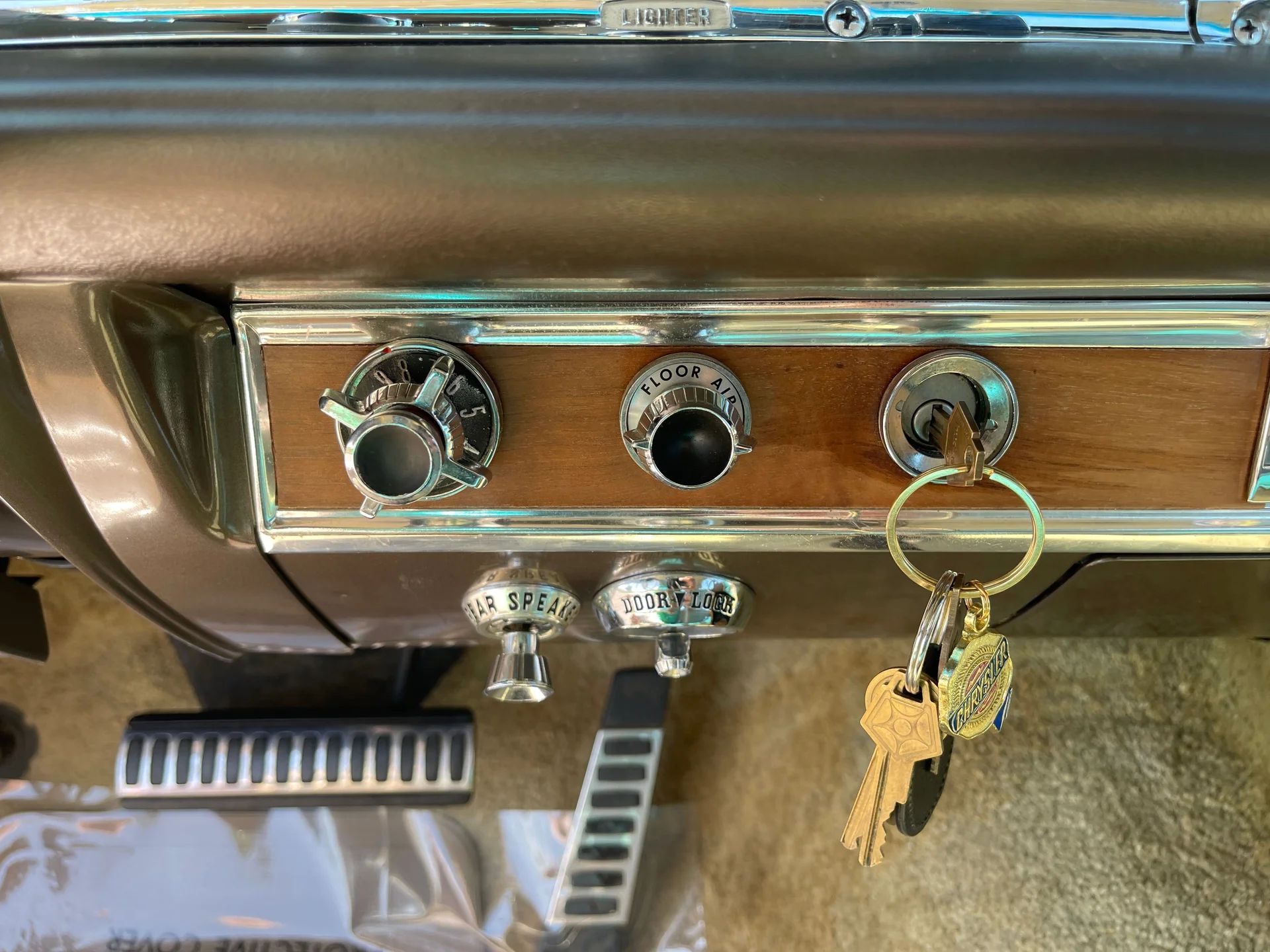 Closeup of center dashboard controls of a 1964 Chrysler