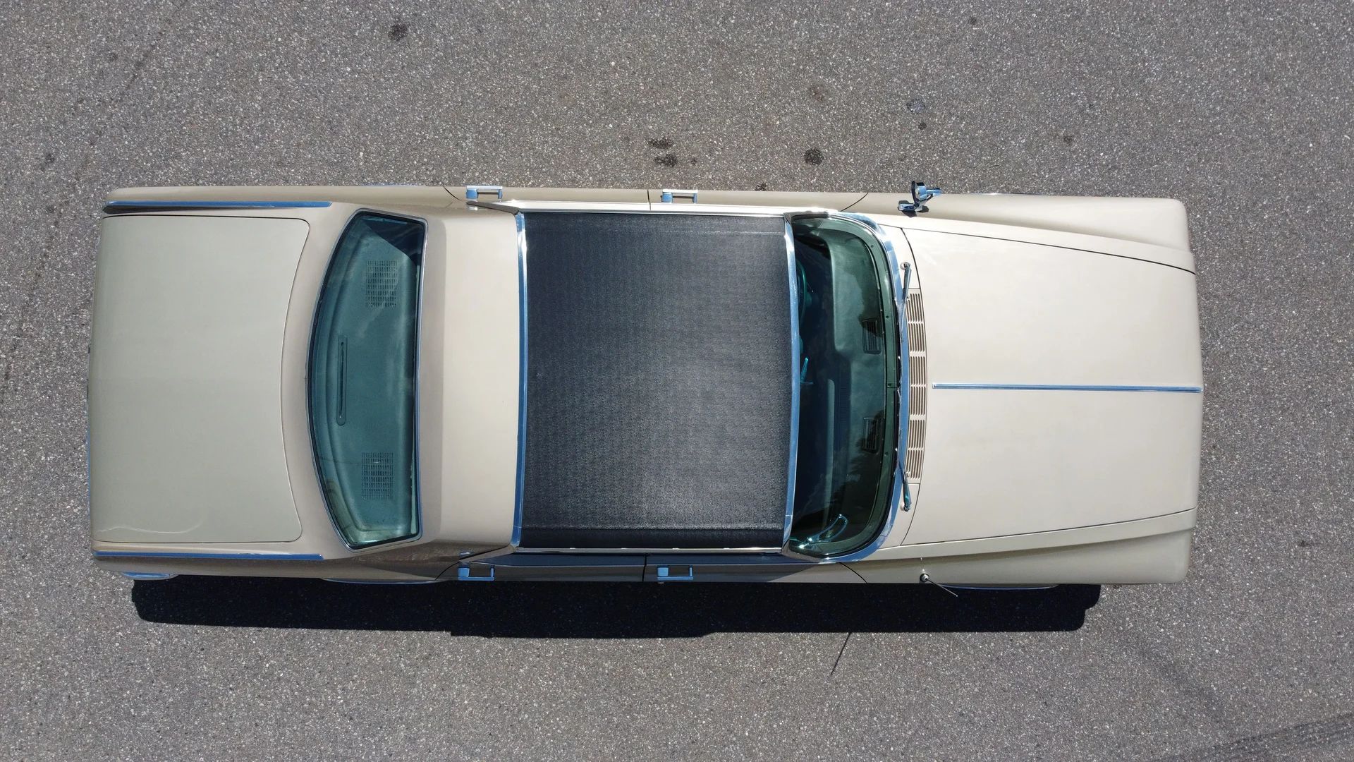 Overhead view of a 1964 Chrysler with a black vinyl half-top