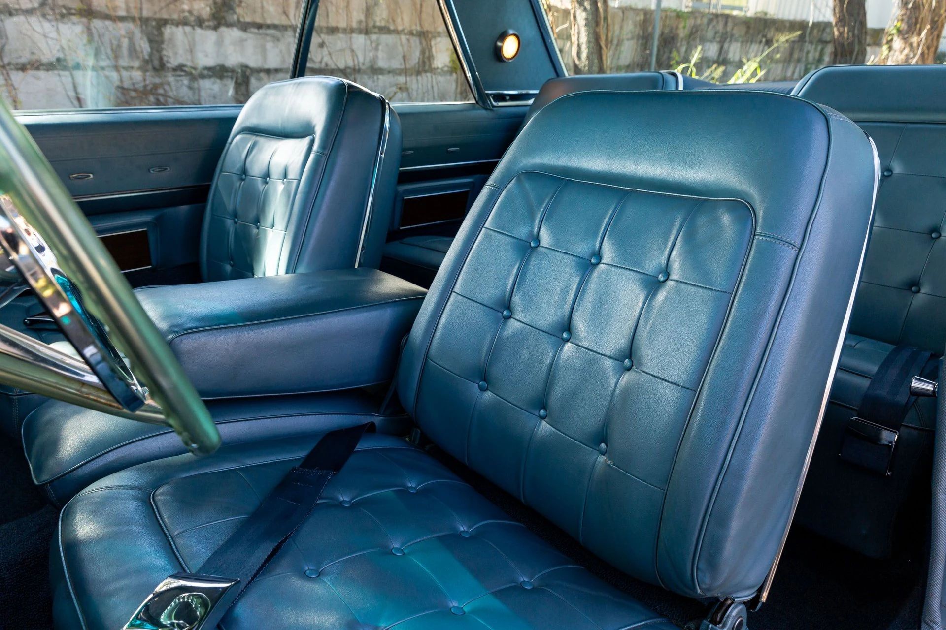 1965 Chrysler New Yorker: Bucket Seats Return To This Full-Size Luxury Two-Door Hardtop 22 Front bucket seats in a 1965 Chrysler, seen through the driver's door