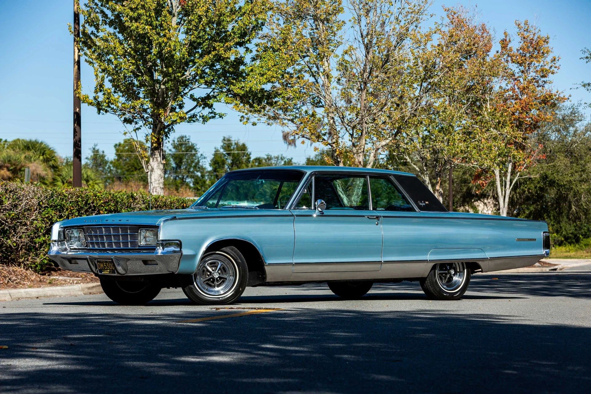 1965 Chrysler New Yorker: Bucket Seats Return To This Full-Size Luxury Two-Door Hardtop 20 Left front 3q view of a 1965 Chrysler two-door hardtop parked diagonally in the middle of a street