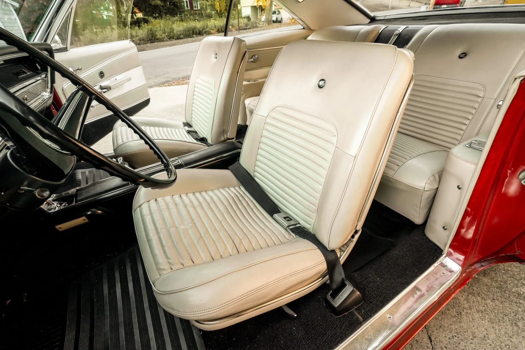 1966 Buick Wildcat Custom Gran Sport: One-Year-Only Full-Size Buick Muscle "For Young People Of All Ages" 12 Front bucket seats of a 1966 Buick, seen through the driver's door