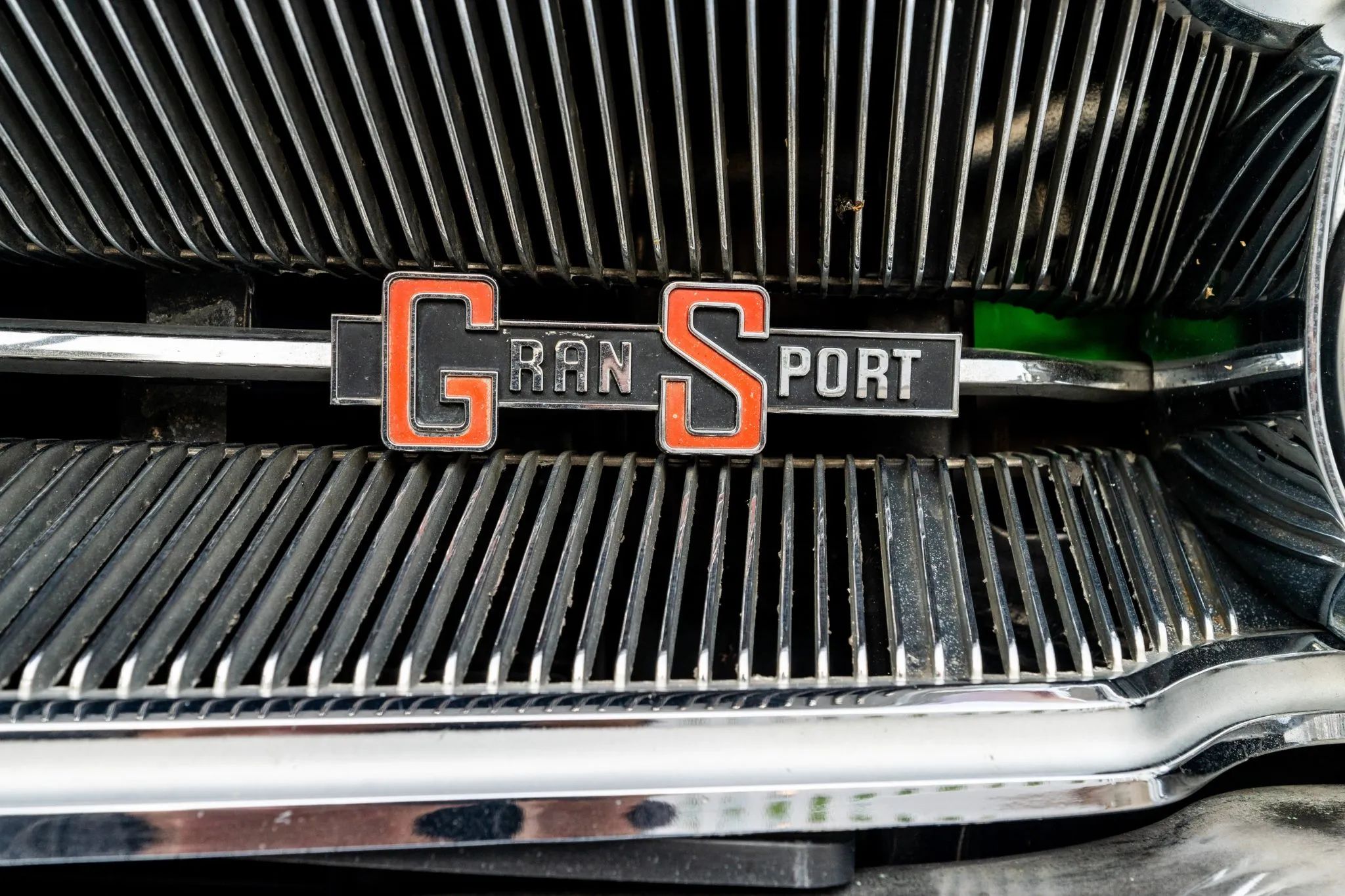 1966 Buick Wildcat Custom Gran Sport: One-Year-Only Full-Size Buick Muscle "For Young People Of All Ages" 2 Closeup of "Gran Sport" badge on the grille of a 1966 Buick