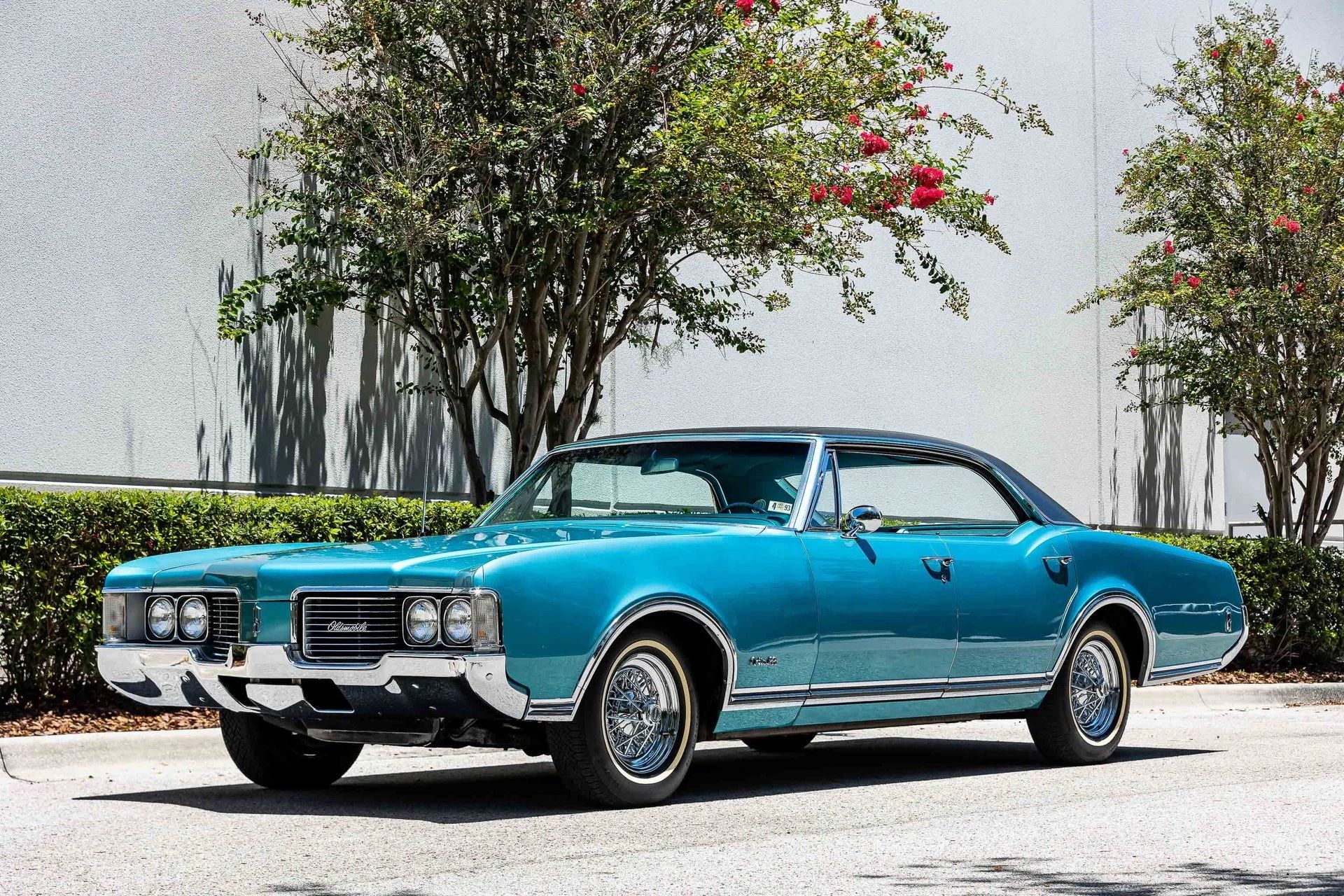 1968 Oldsmobile Delta 88 Holiday Sedan: A Cool Blue Olds "Youngmobile" In Ocean Turquoise 8 Left front 3q view of a 1968 Oldsmobile four-door hardtop parked under a tree