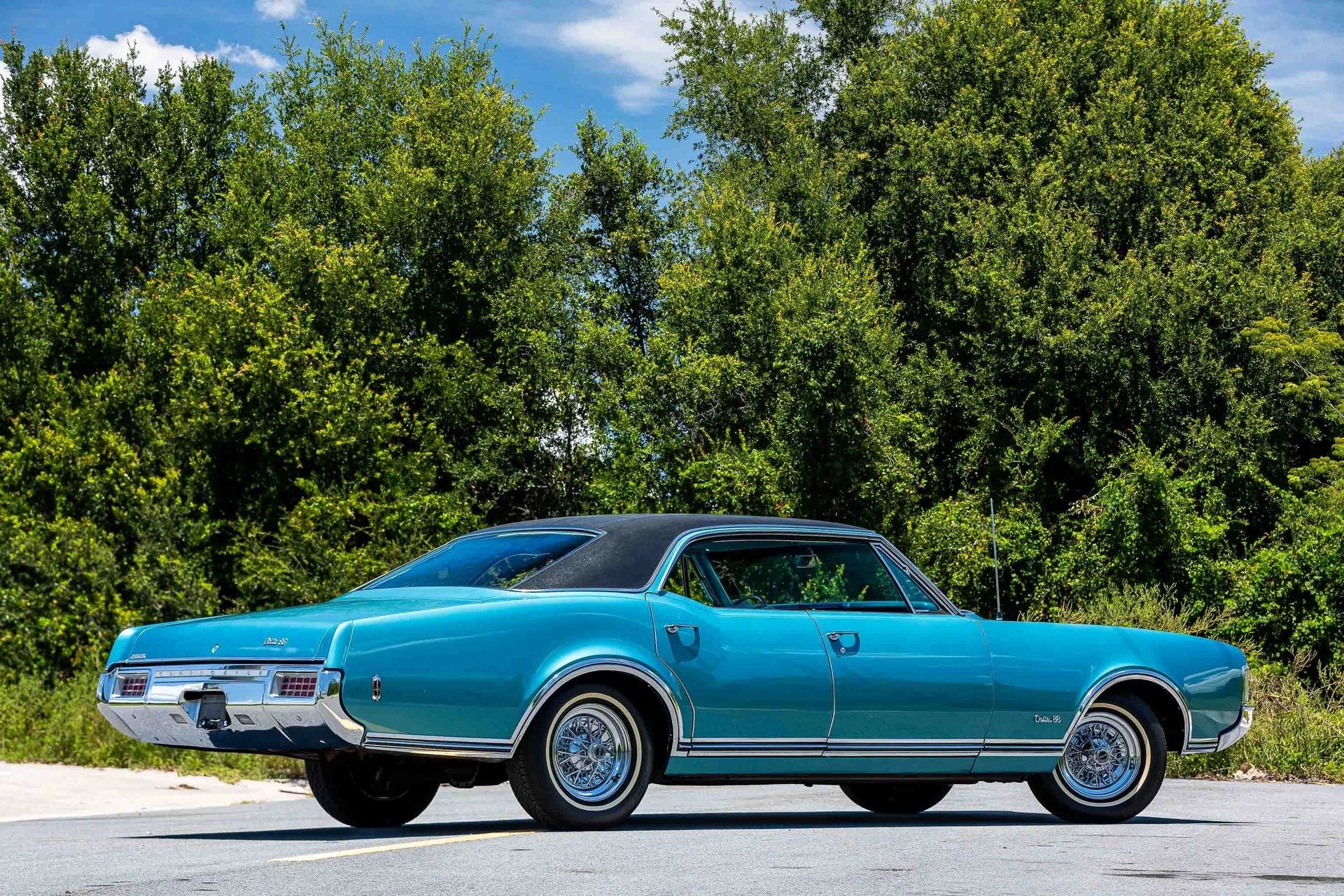1968 Oldsmobile Delta 88 Holiday Sedan: A Cool Blue Olds "Youngmobile" In Ocean Turquoise 20 Right rear 3q view of a 1968 Oldsmobile four-door hardtop parked in the middle of a street