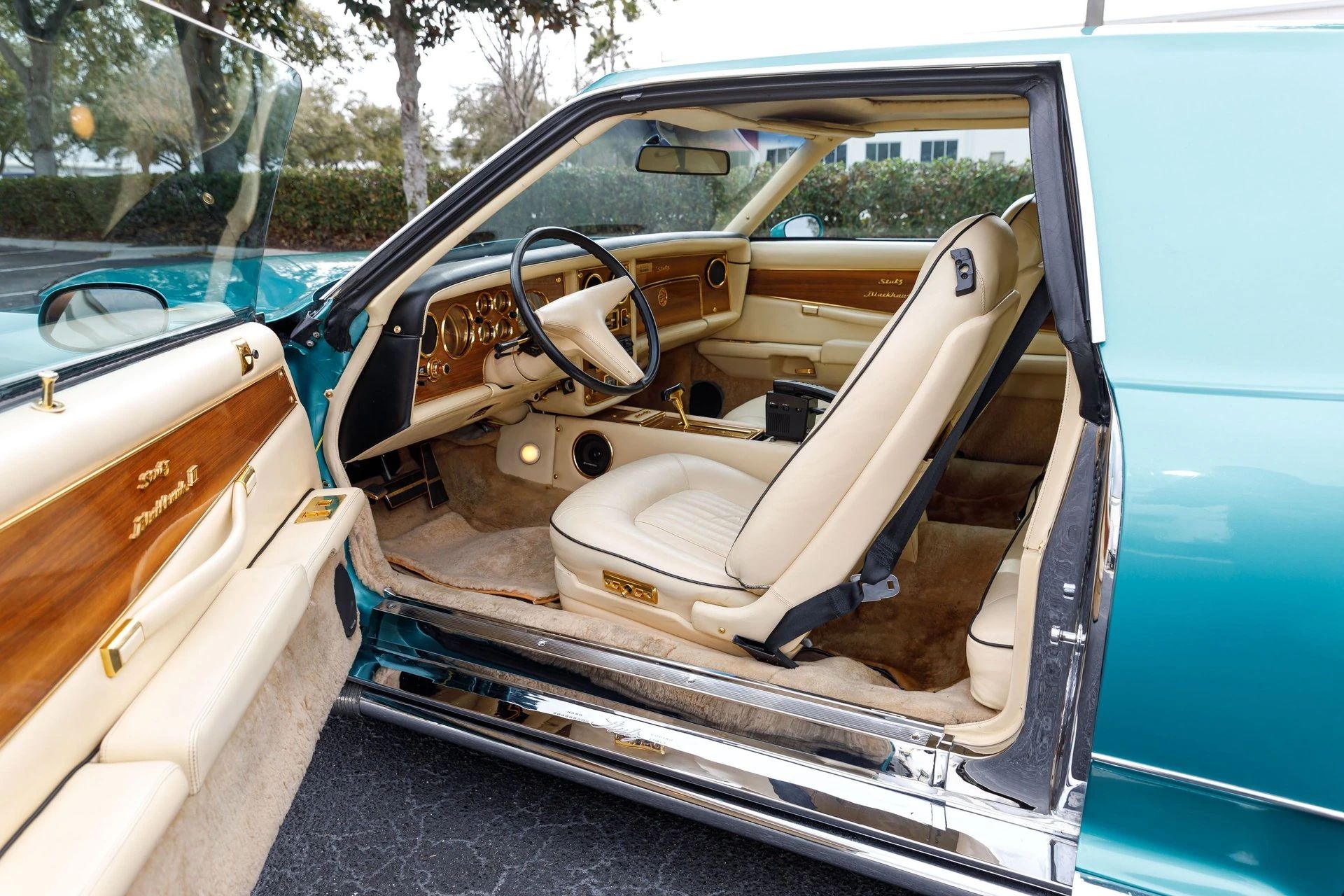 Stutz coupe with the driver's door open, revealing the interior