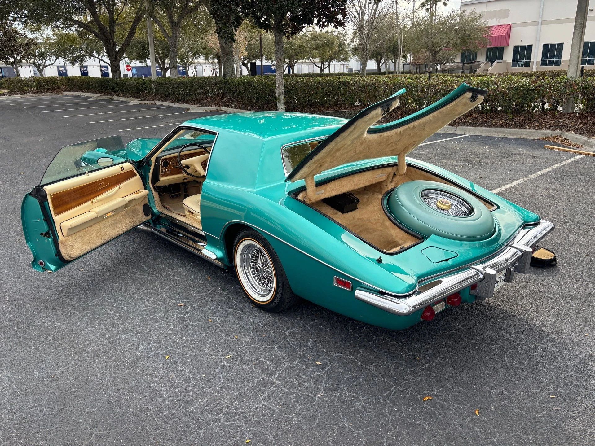 Left rear 3q view of a Stutz coupe with the doors and trunk open