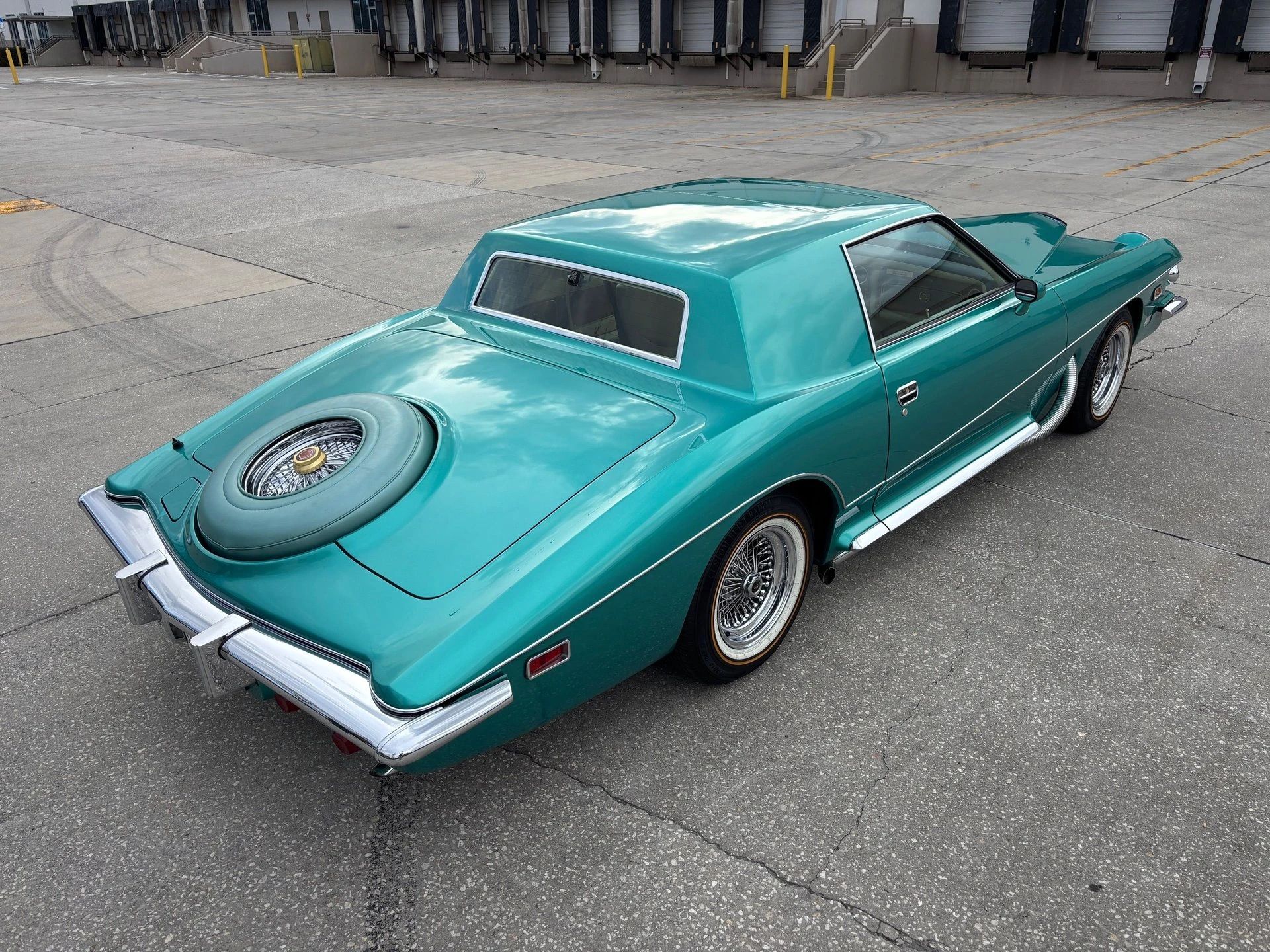High-angle right rear 3q view of a 1978 Stutz, showing off its spare tire hump and simulated running boards
