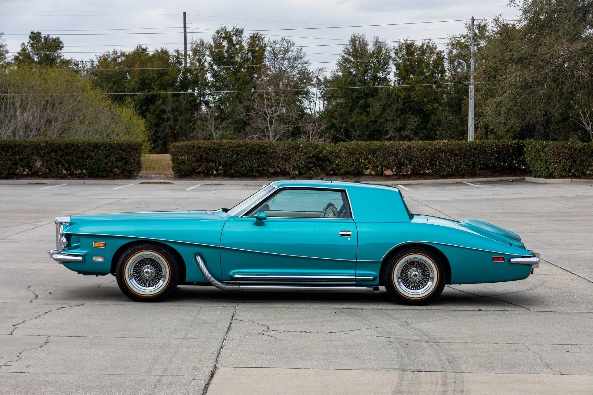 Left side view of a turquoise 1978 Stutz coupe